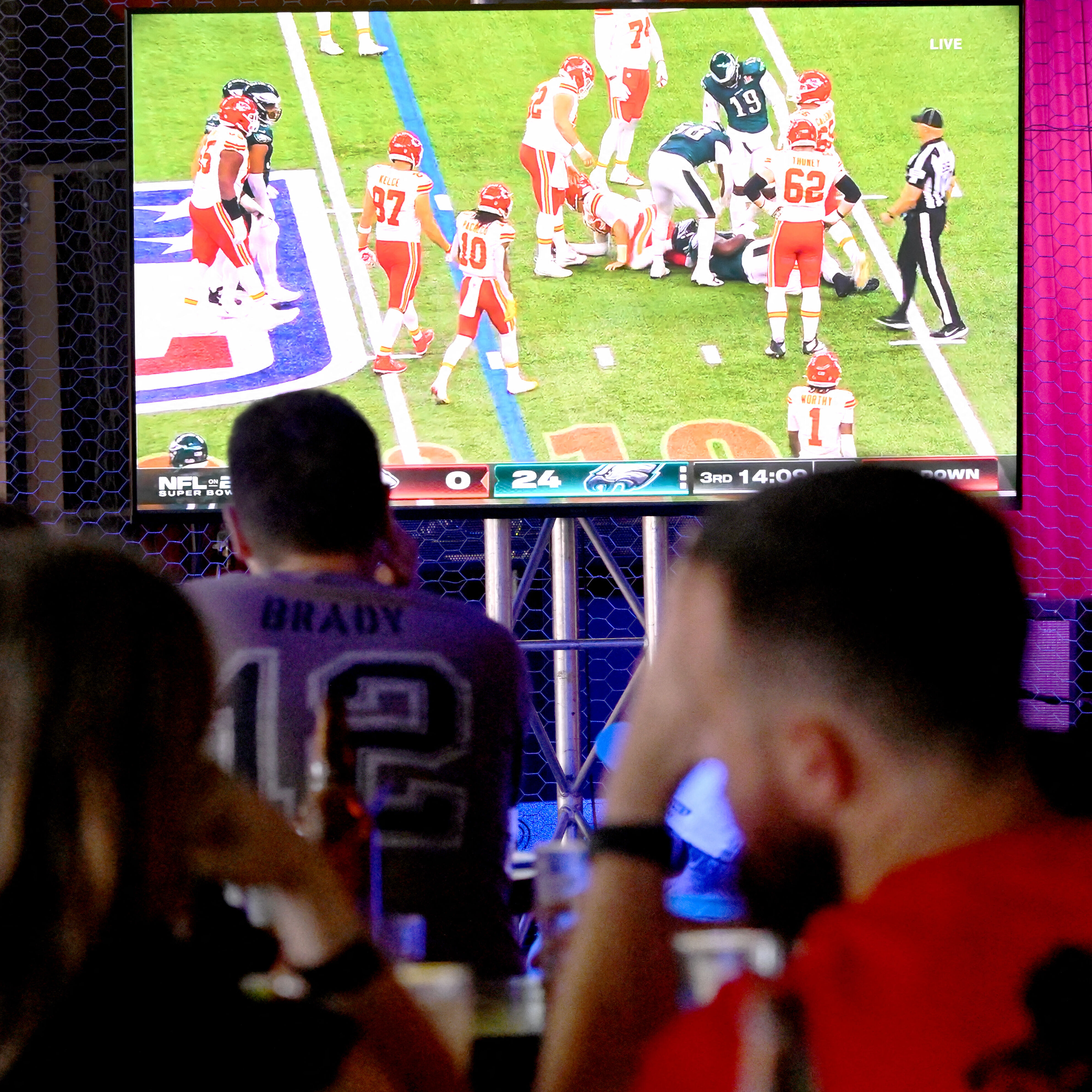 Fans watch the broadcast of the NFL Super Bowl on February 8, 2026.
