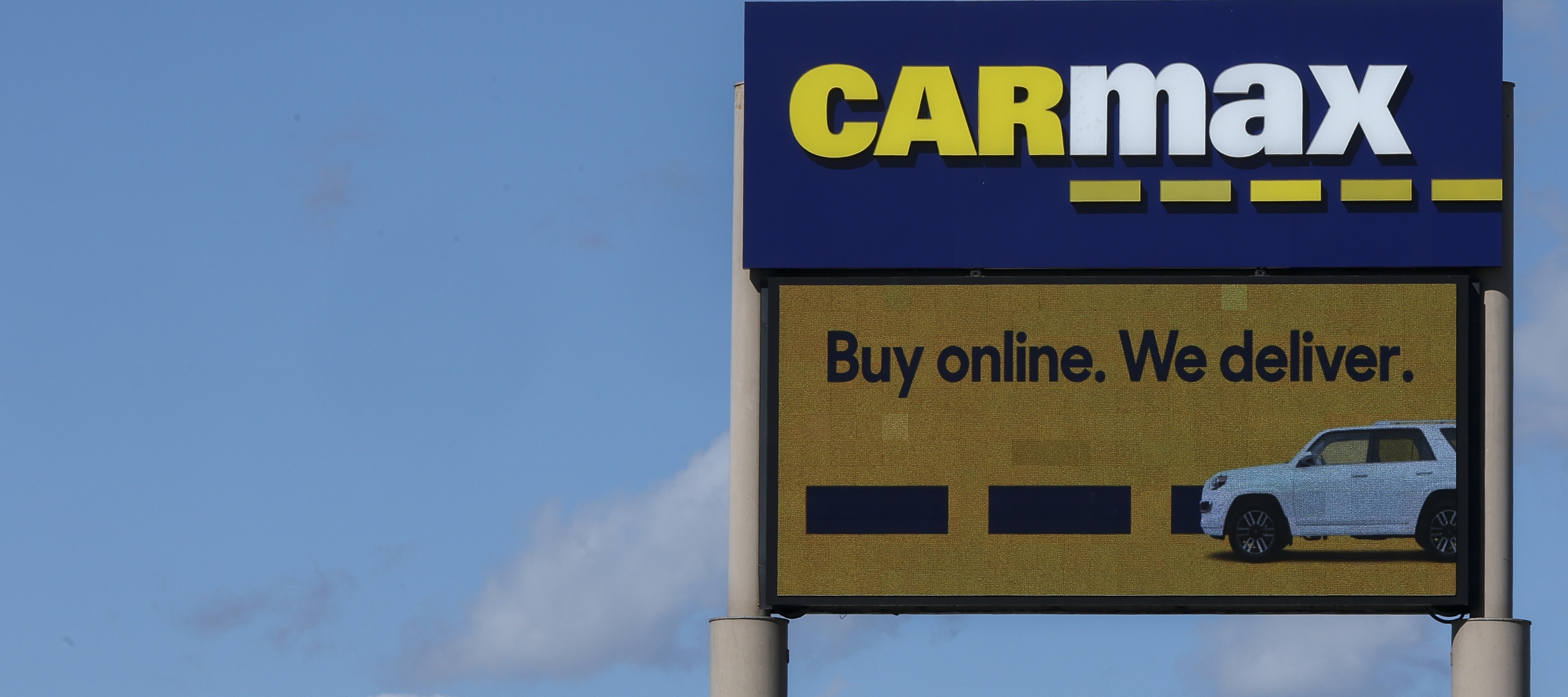 A detail view of CarMax signage is in Inglewood, California