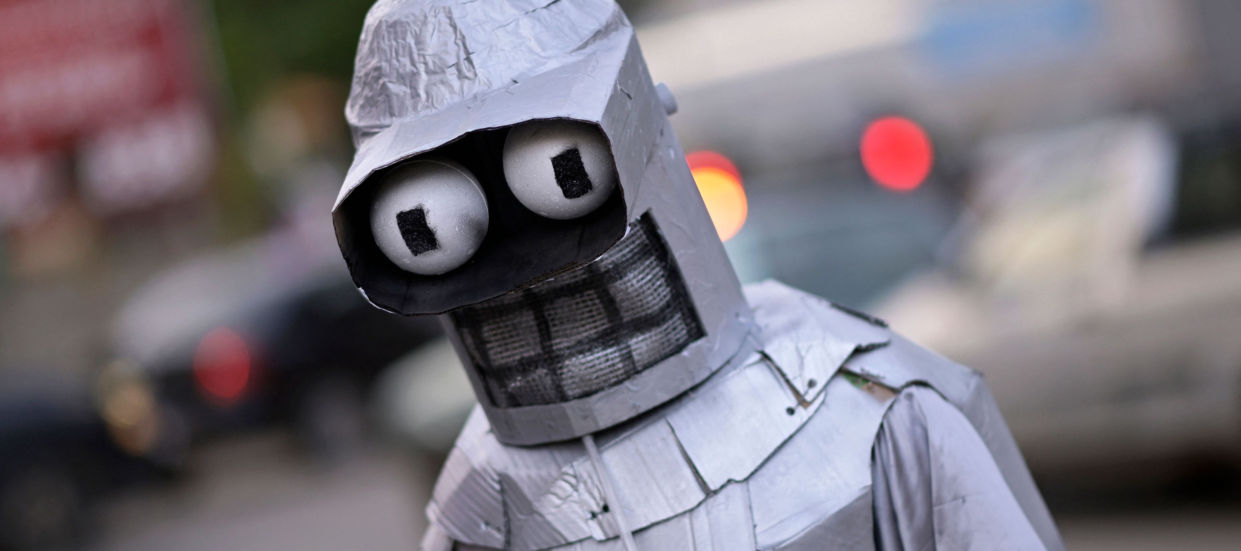 Someone attending the Masquerade Party in Brazil dresses up as a robot.