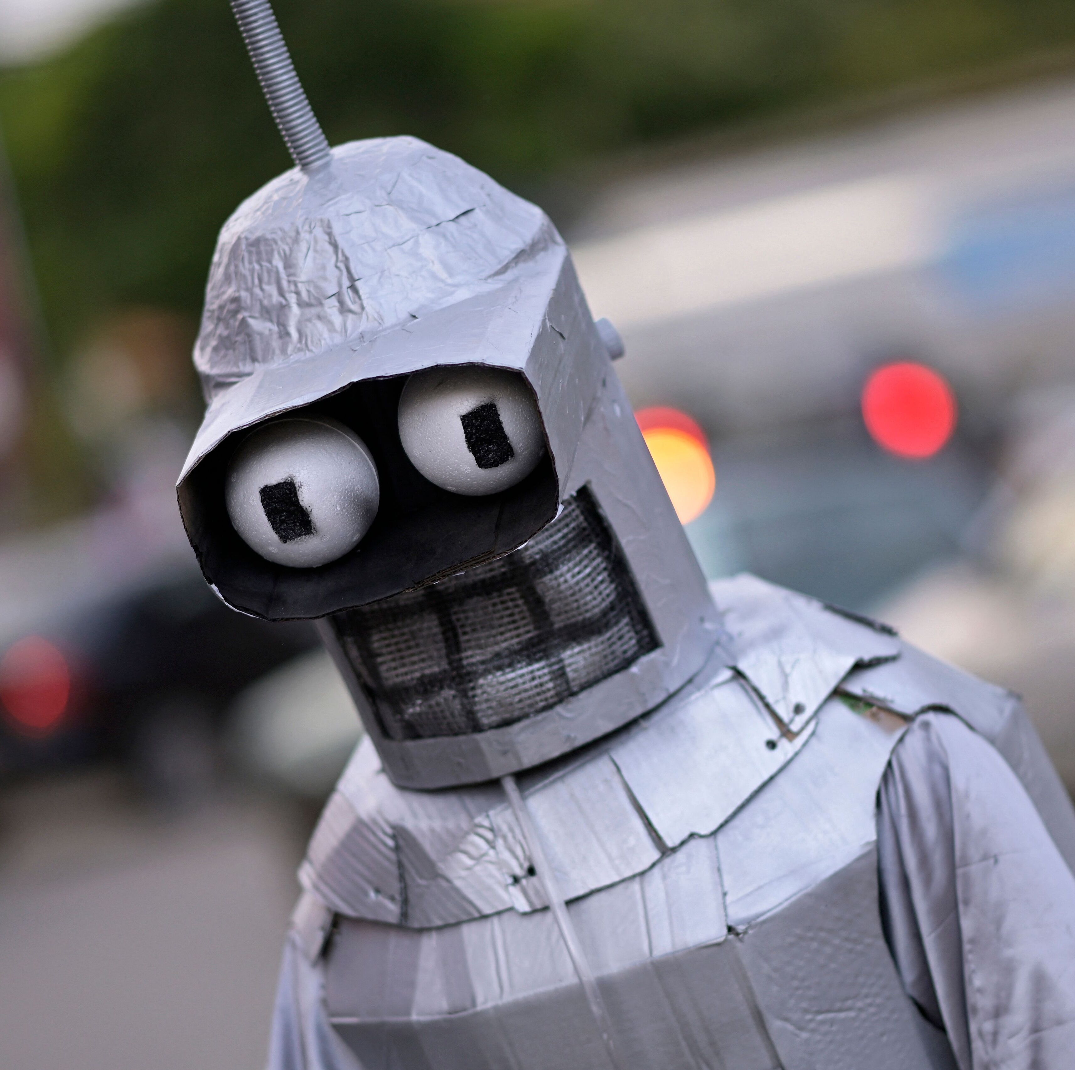 Someone attending the Masquerade Party in Brazil dresses up as a robot.