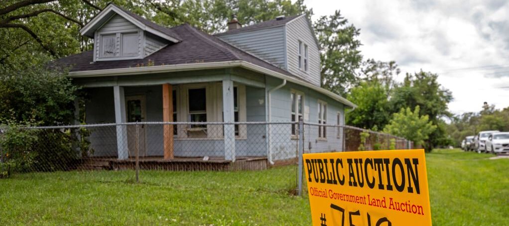 Southfield, Michigan, A sign advertises the upcoming online auction of a home foreclosed because of nonpayment of taxes.