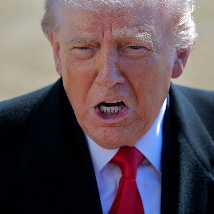 A photo of President Donald Trump talking to reporters