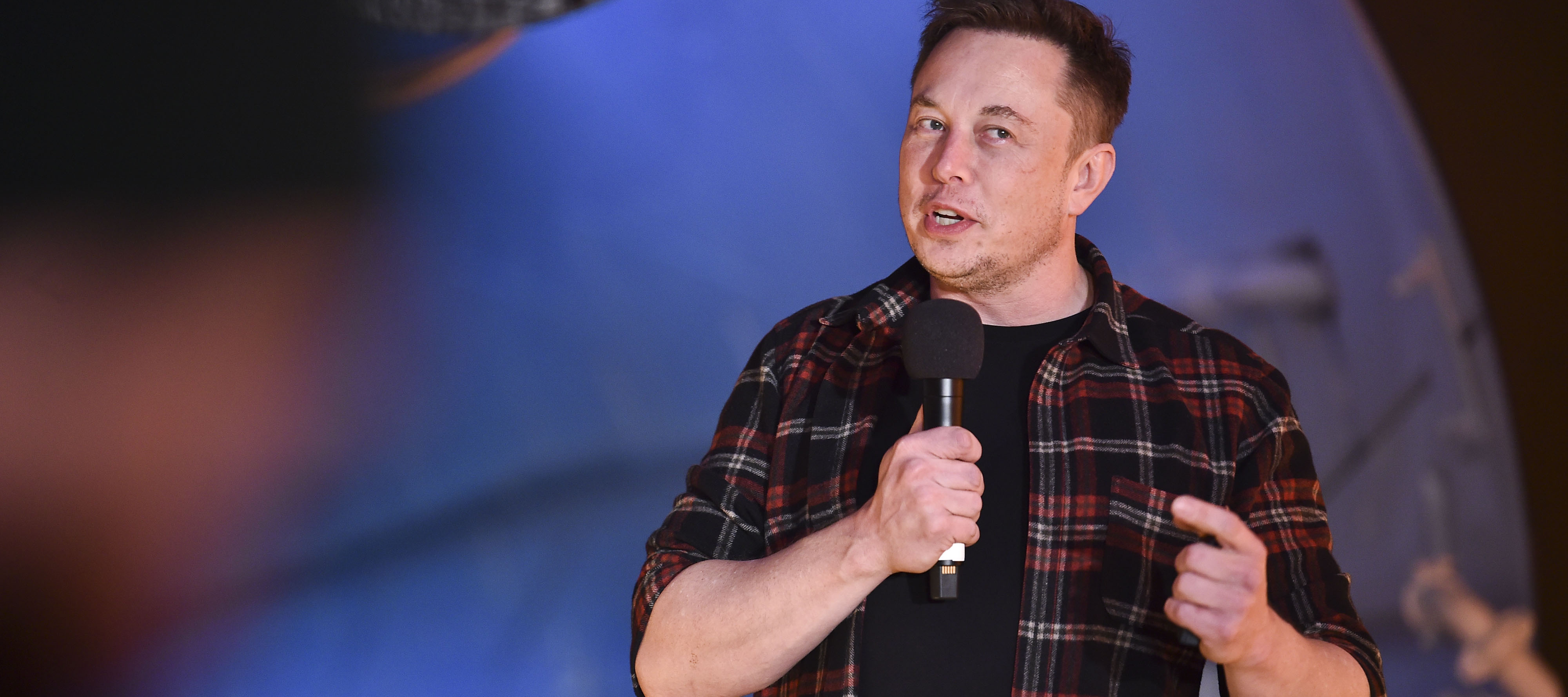 SpaceX CEO Elon Musk speaks to a crowd gathered at an event in California.