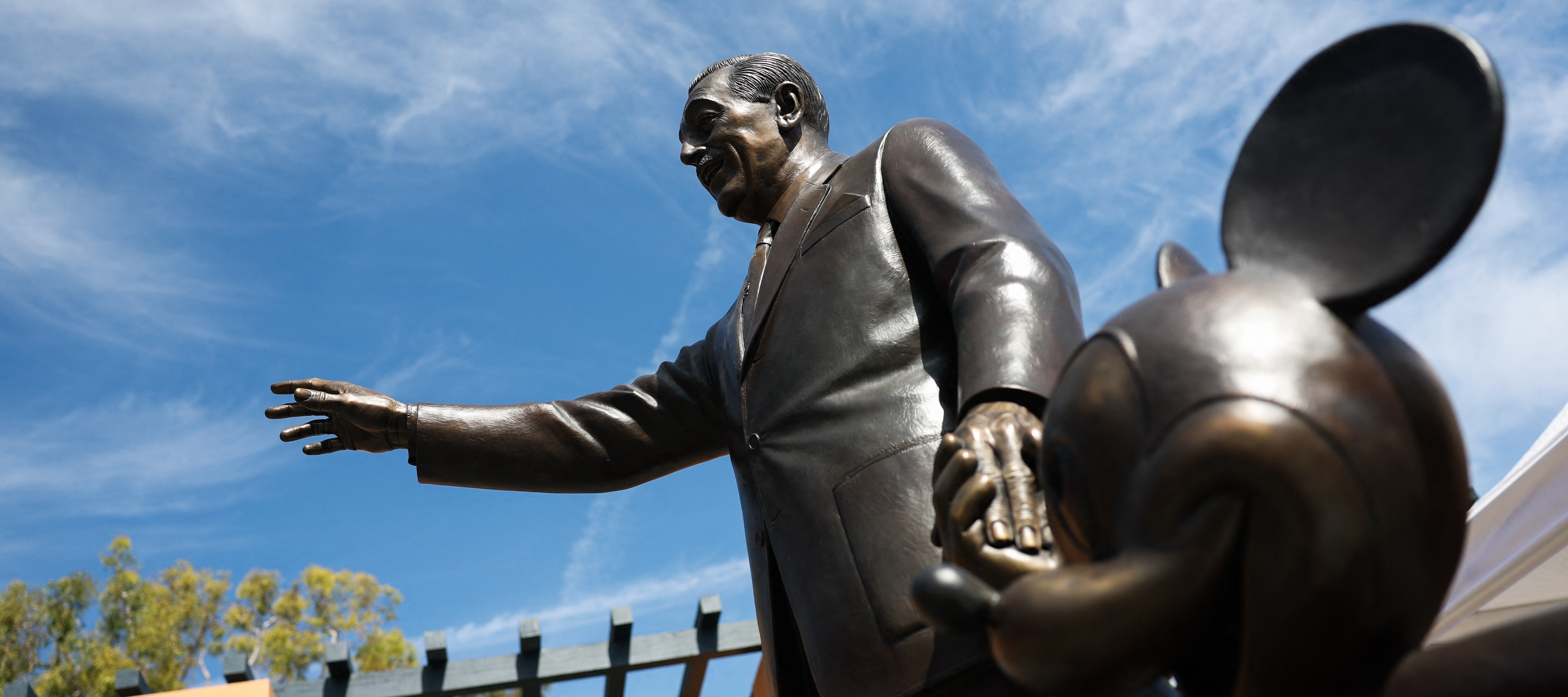 A statue of Walt Disney and Mickey Mouse is displayed outside of the Michael D. Eisner Building during a tour of the Walt Disney Studios Archive.