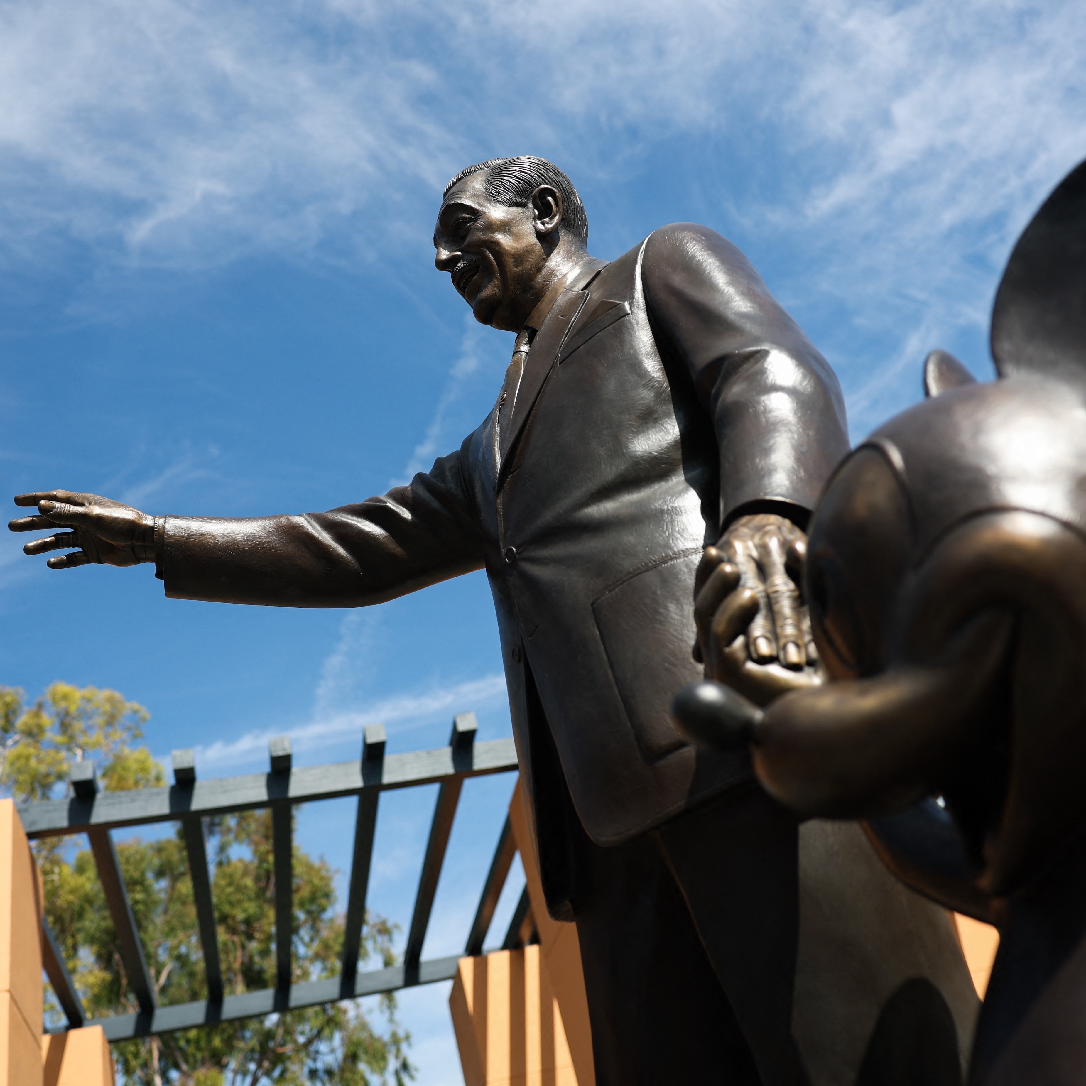 A statue of Walt Disney and Mickey Mouse is displayed outside of the Michael D. Eisner Building during a tour of the Walt Disney Studios Archive.