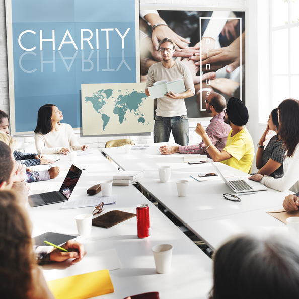 Photo of a room of people in a charity-focused meeting