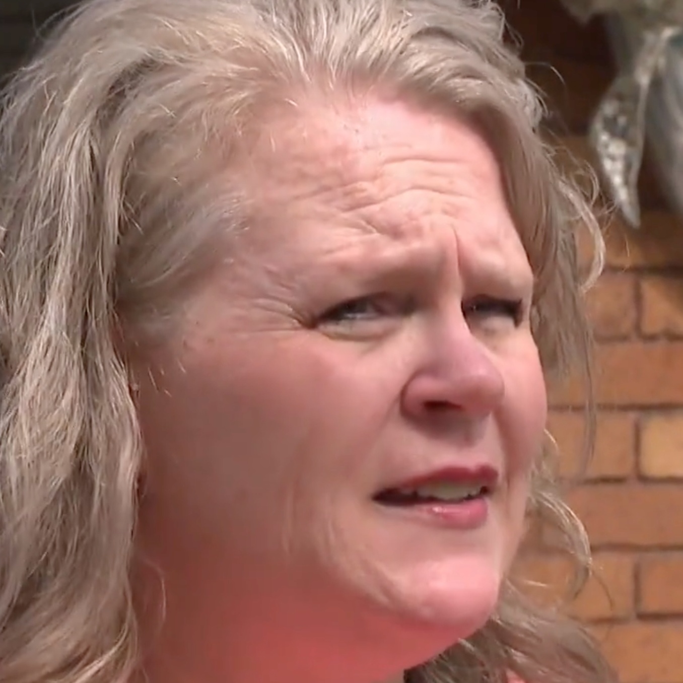 Camie Hubbard discussed home damage with CBS, damage to walls is displayed on the right