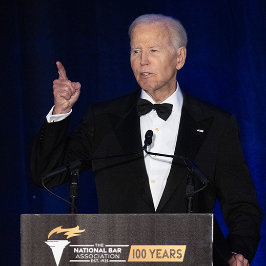 The logo for Polymarket is paired with a photo of former president Joe Biden.