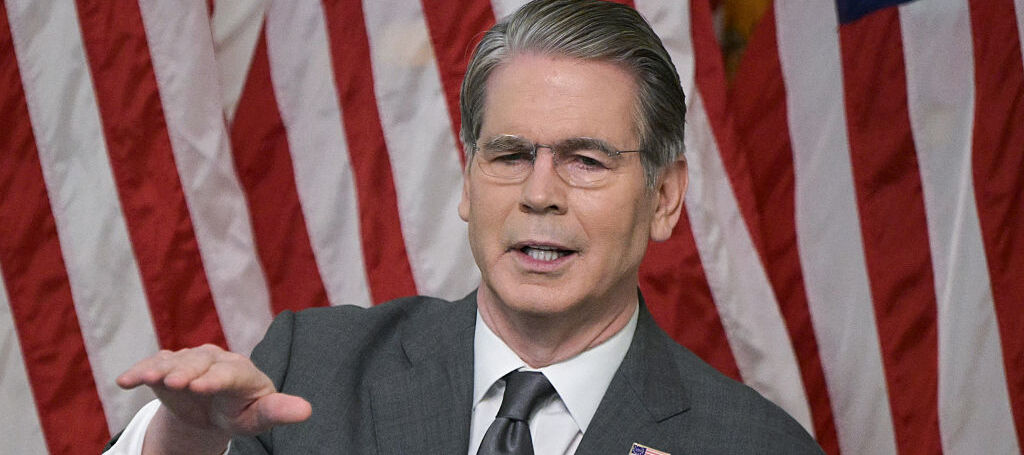 US Treasury Secretary Scott Bessent speaks during a roundtable event in front of the American flag
