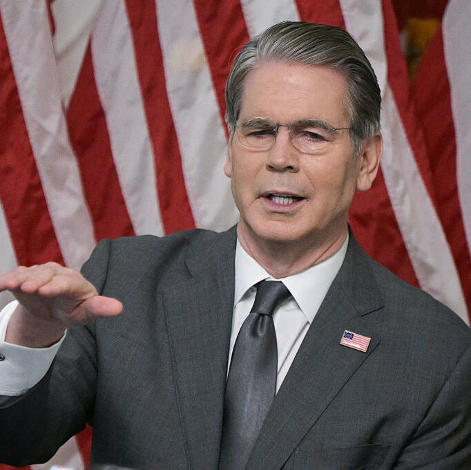 US Treasury Secretary Scott Bessent speaks during a roundtable event in front of the American flag