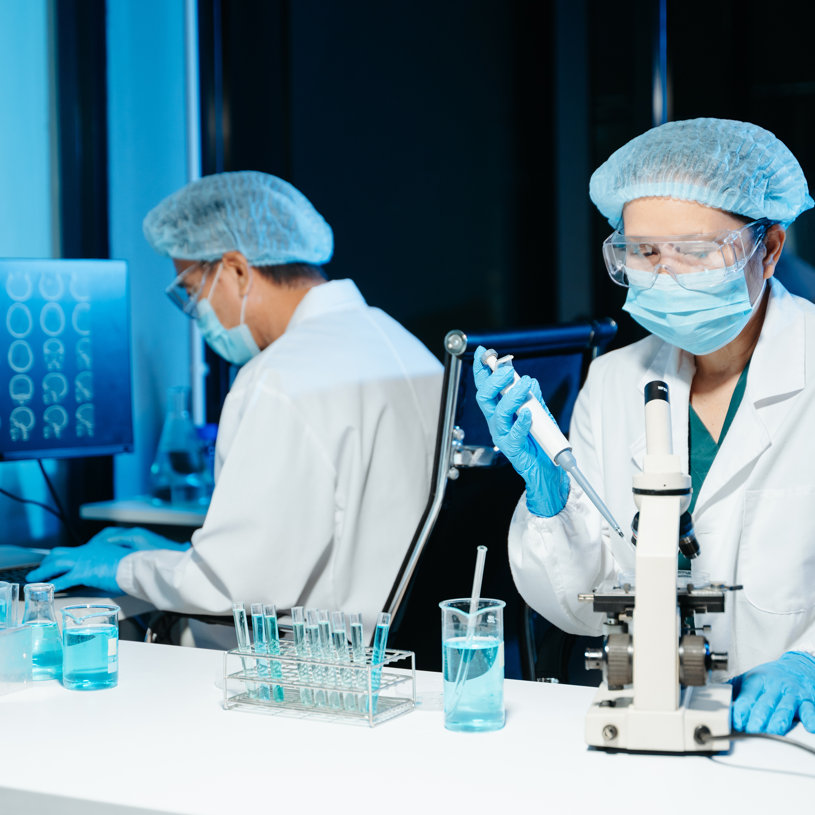 Scientists run tests in a lab.