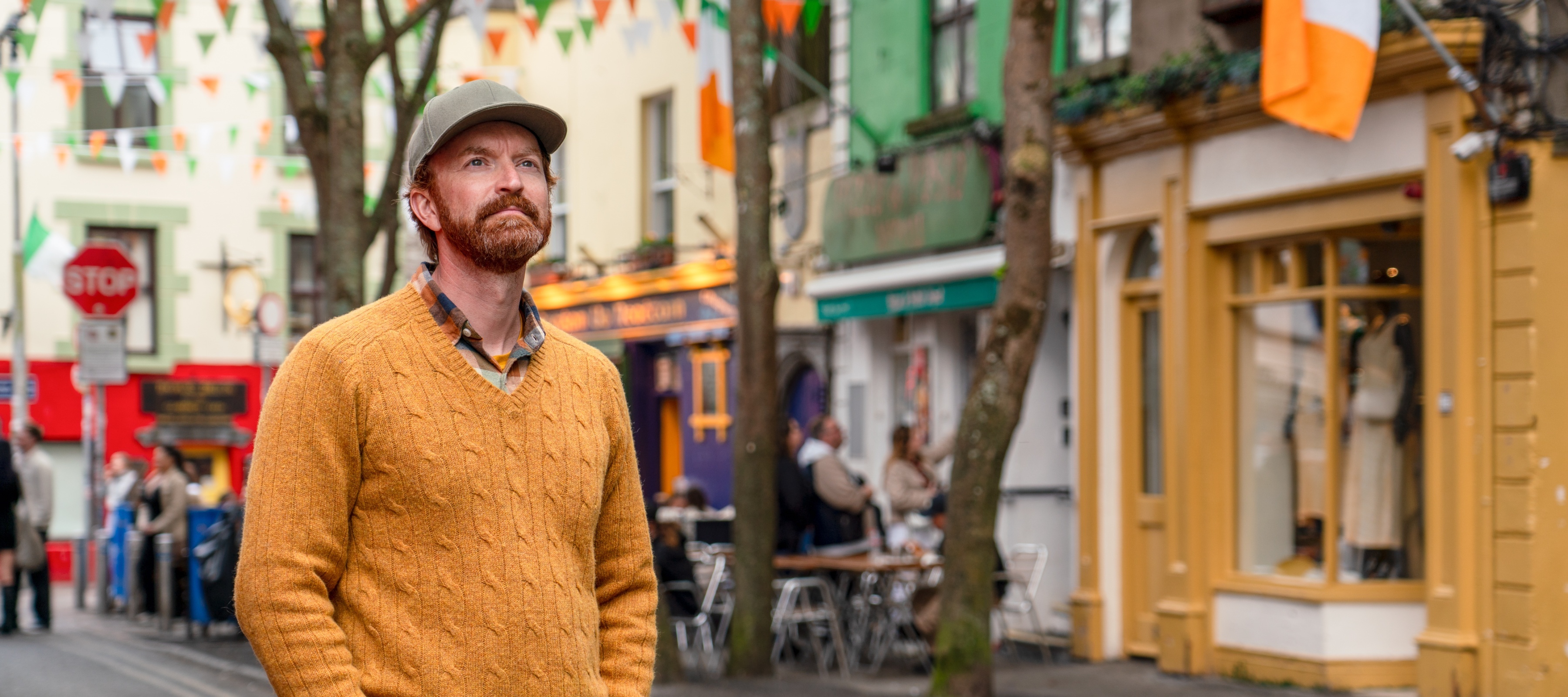 A man stands on Quay Street in Galway, Ireland.