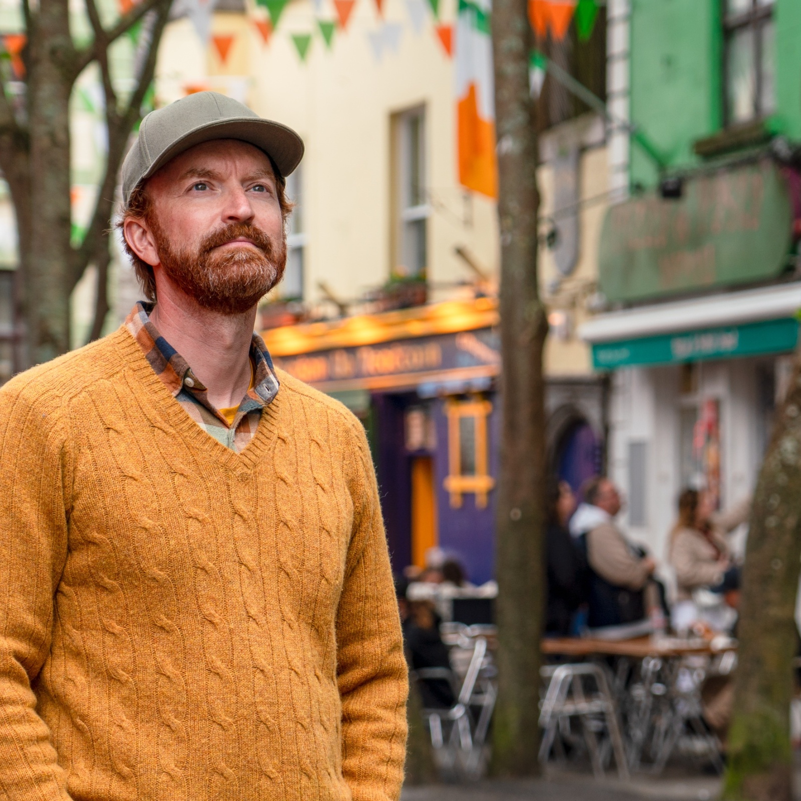 A man stands on Quay Street in Galway, Ireland.