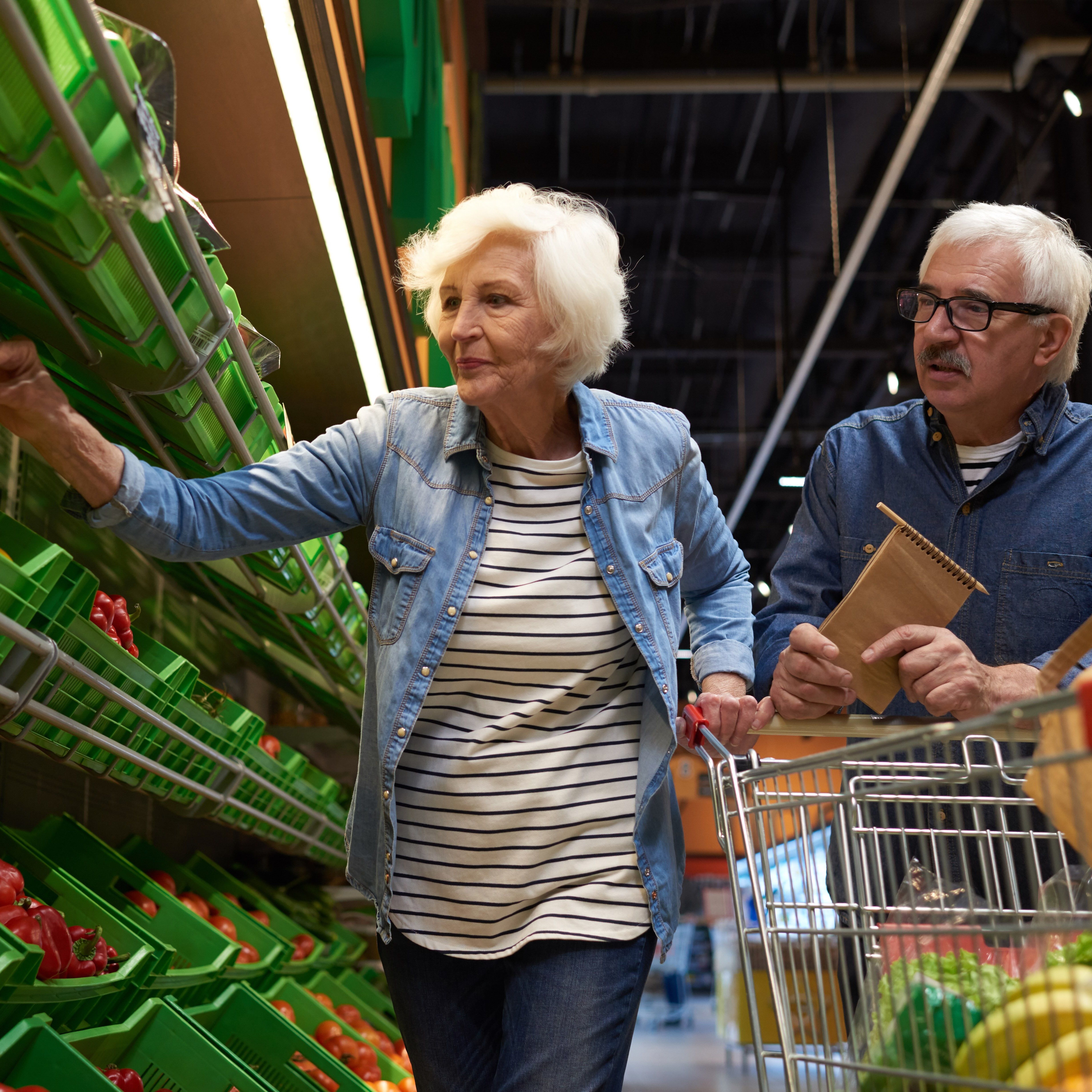 Senior couple shopping for groceries