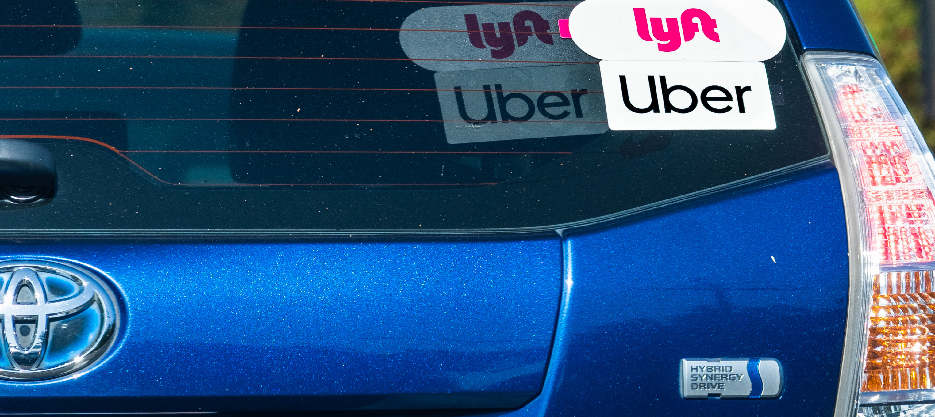 A Toyota Prius offering Lyft and Uber rides in California.