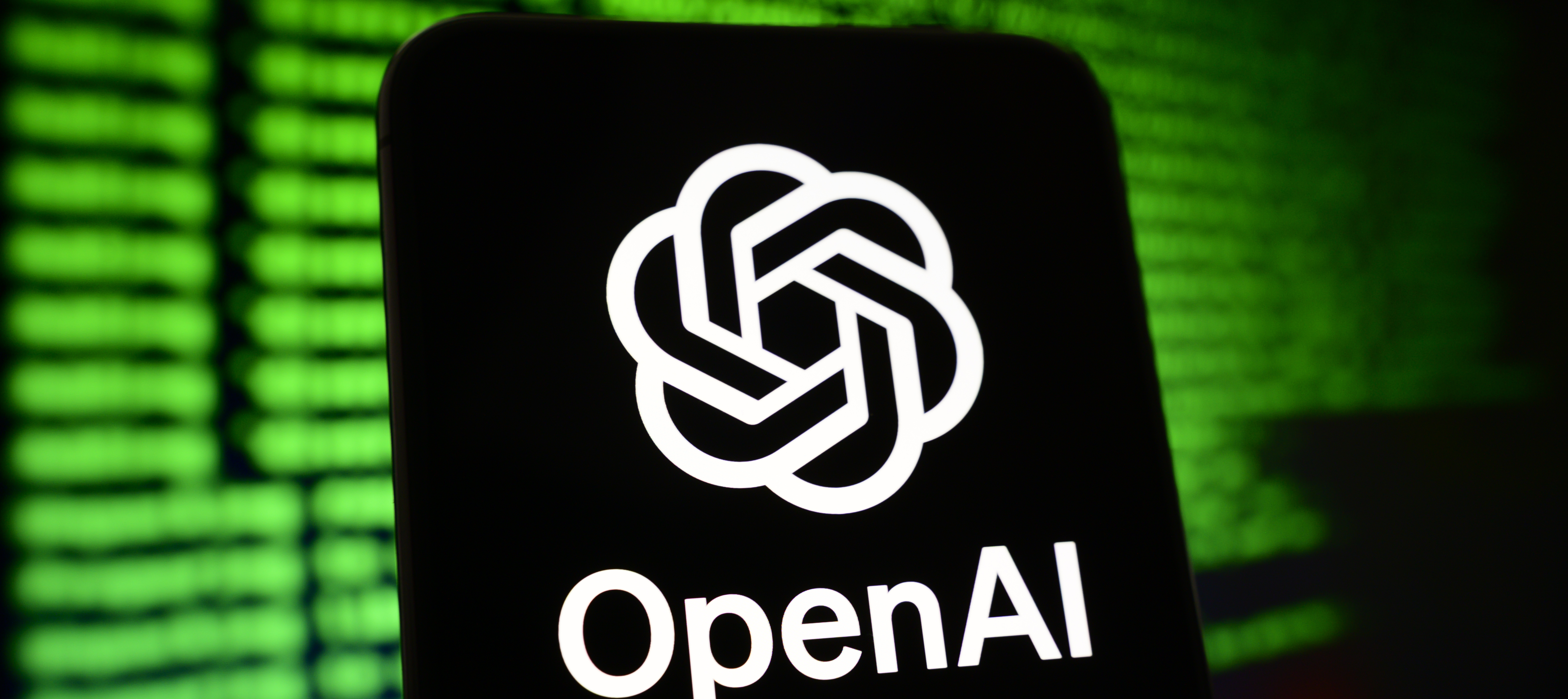 A cell phone displaying the OpenAI logo.