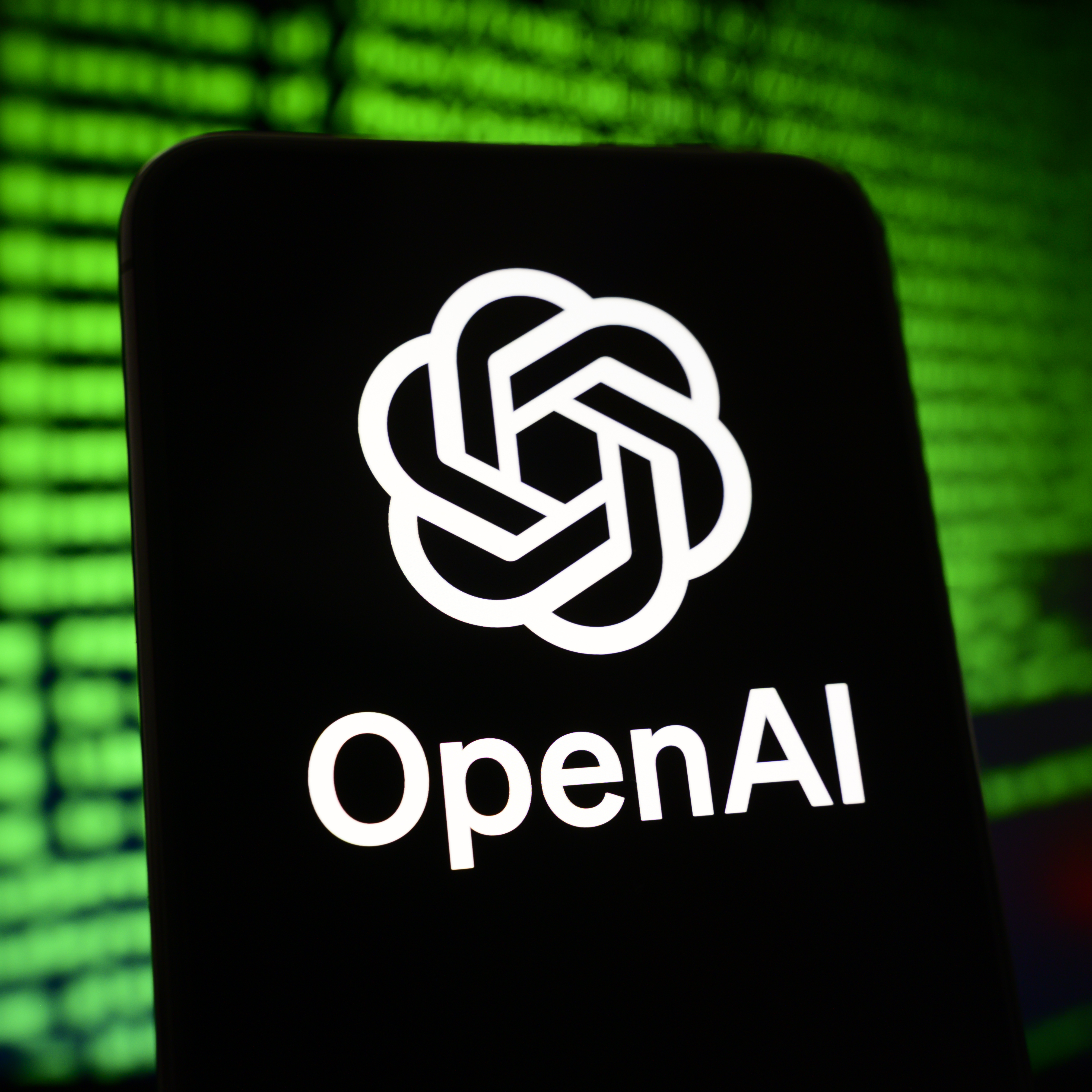 A cell phone displaying the OpenAI logo.