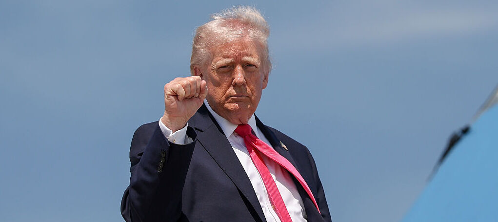 U.S. President Donald Trump gestures as he boards Air Force One at Joint Base Andrews, Maryland.