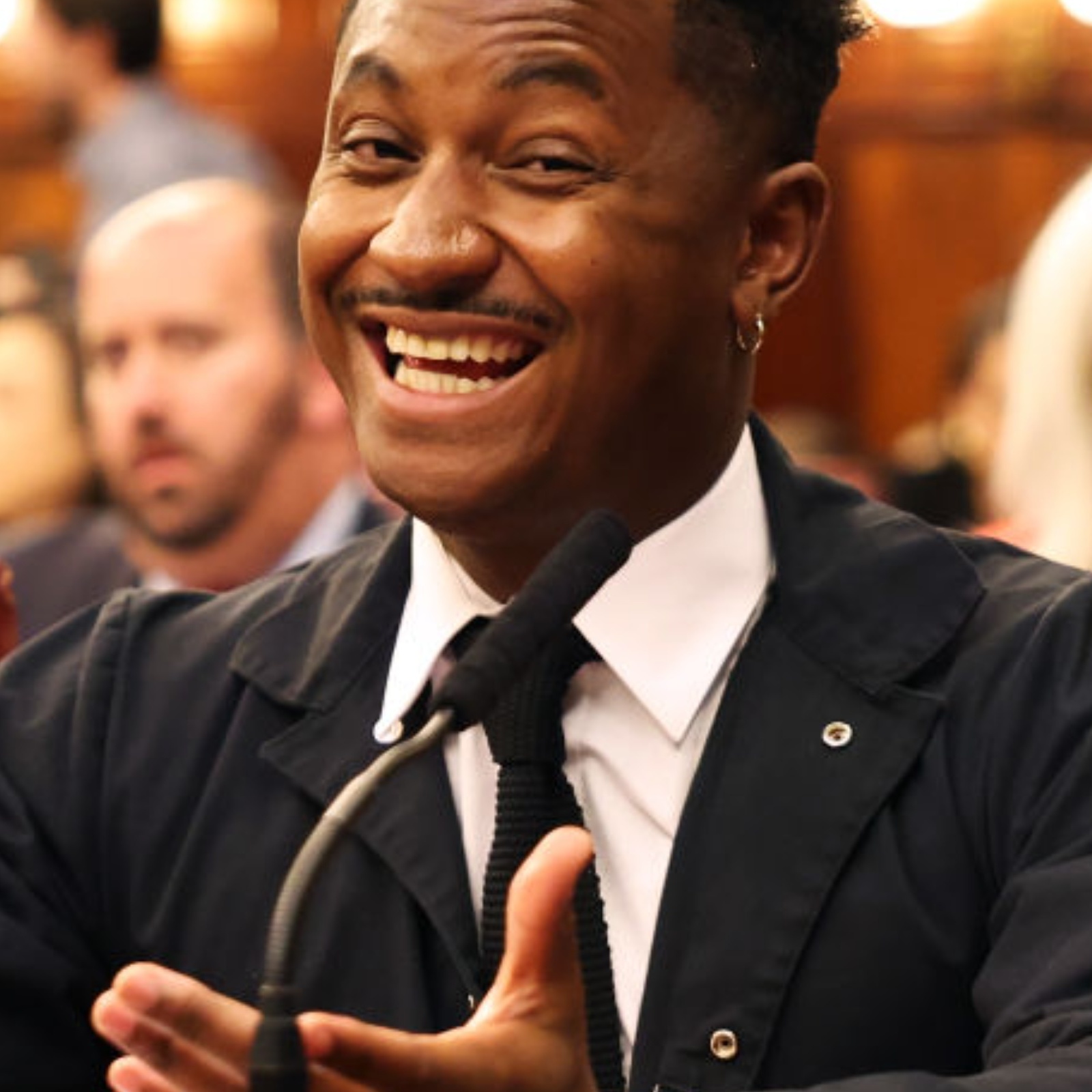 A photo of NYC council member Chi Ossé and a grilled chicken dinner overlay