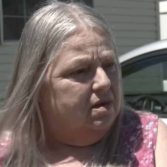Two residents of the trailer park speak with reporters.
