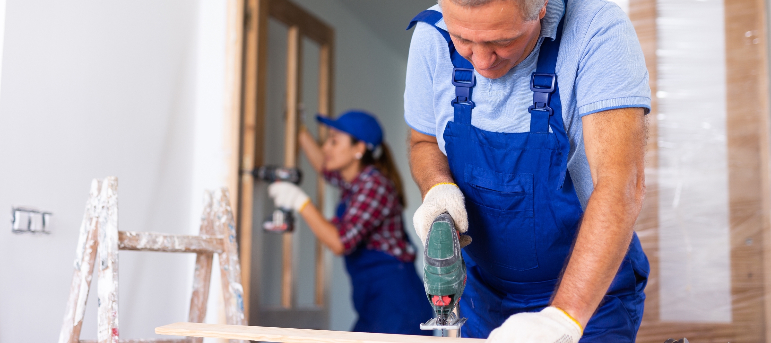 A couple working on renovations to their home.