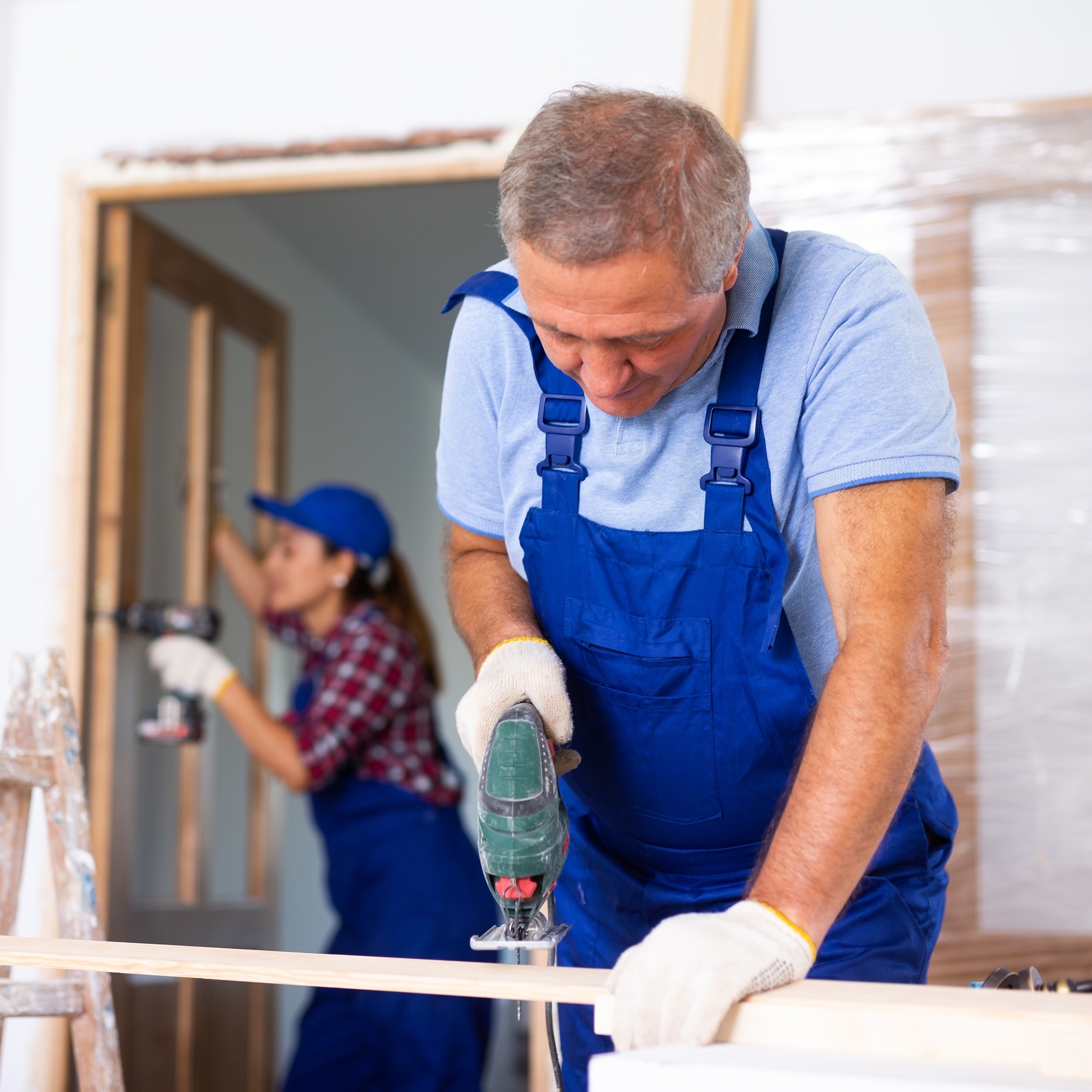 A couple working on renovations to their home.