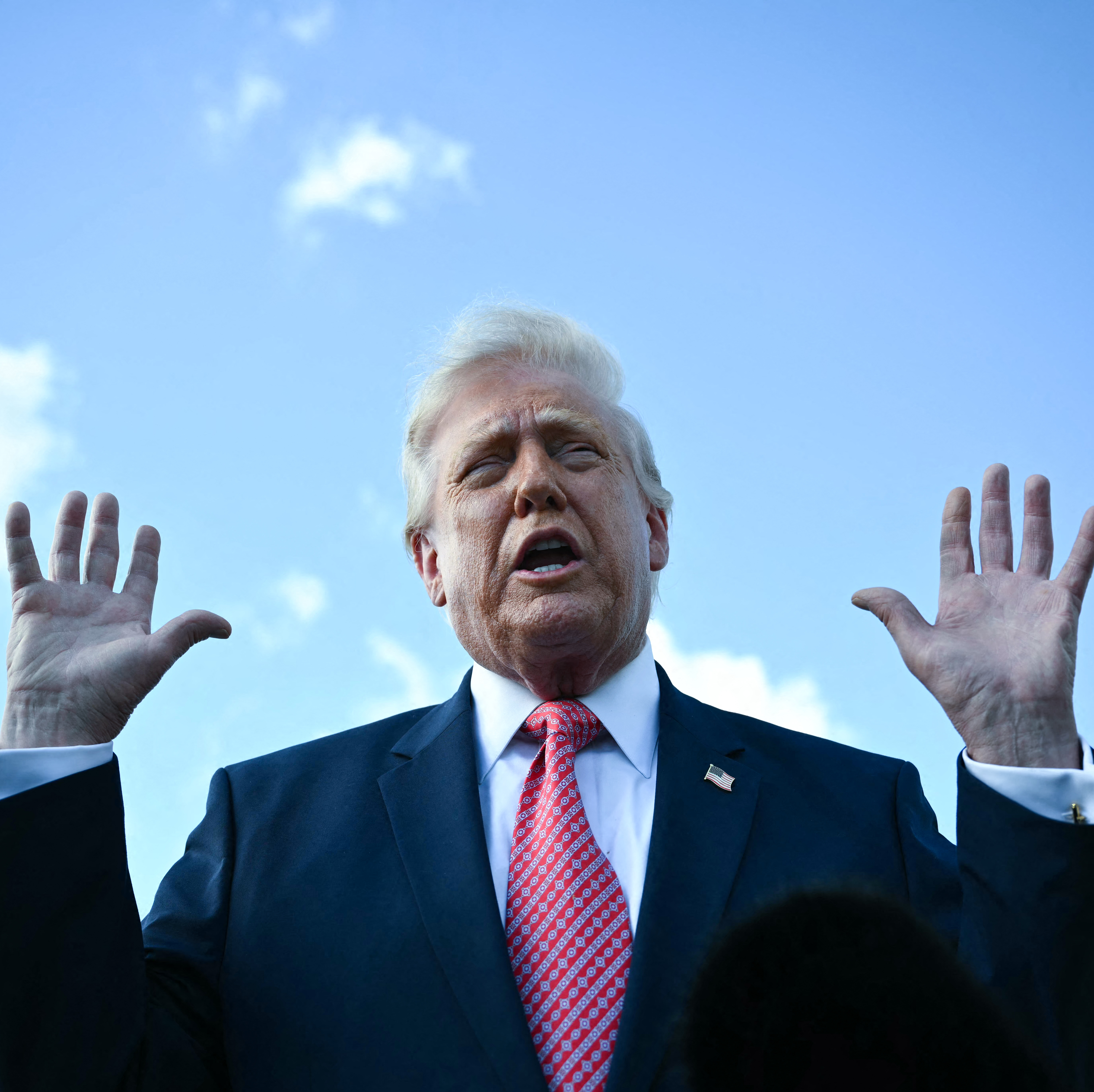 President Donald Trump, seen here speaking to press in Miami, designated the U.S. electric grid as “essential to the national defense.”