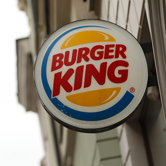 A shot of a New York sewer grill beside a shot of the Burger King logo.