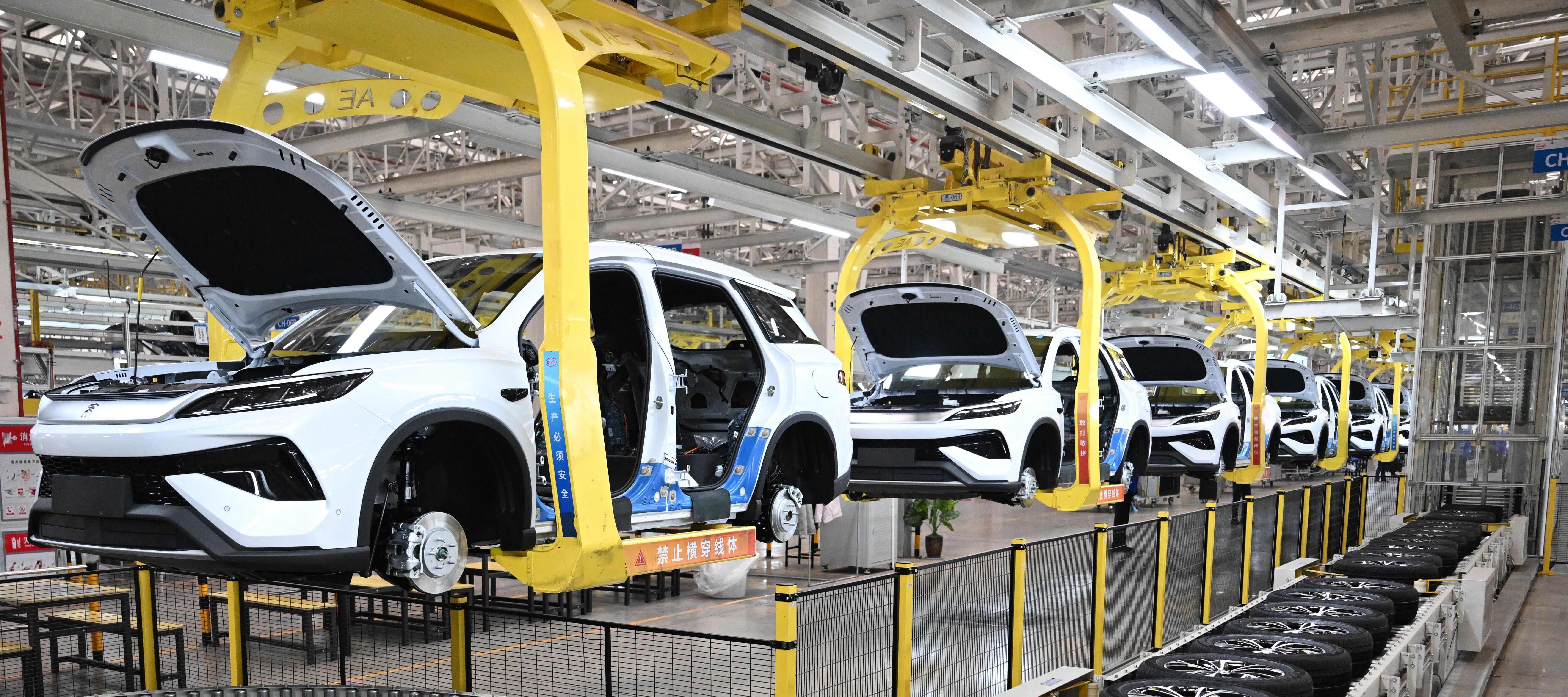 Cars are shown on an assembly line at the BYD plant in Zhengzhou, China.