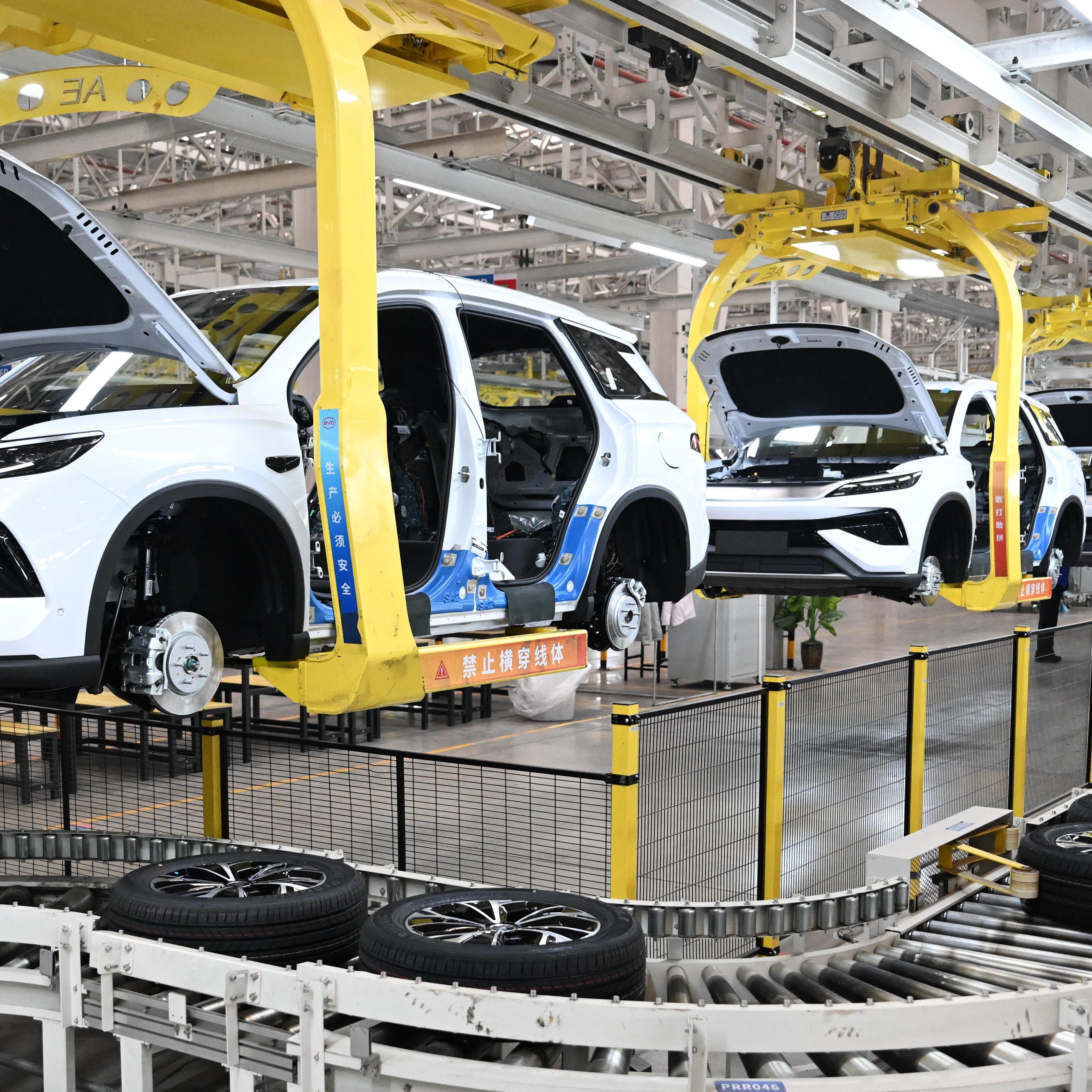 Cars are shown on an assembly line at the BYD plant in Zhengzhou, China.