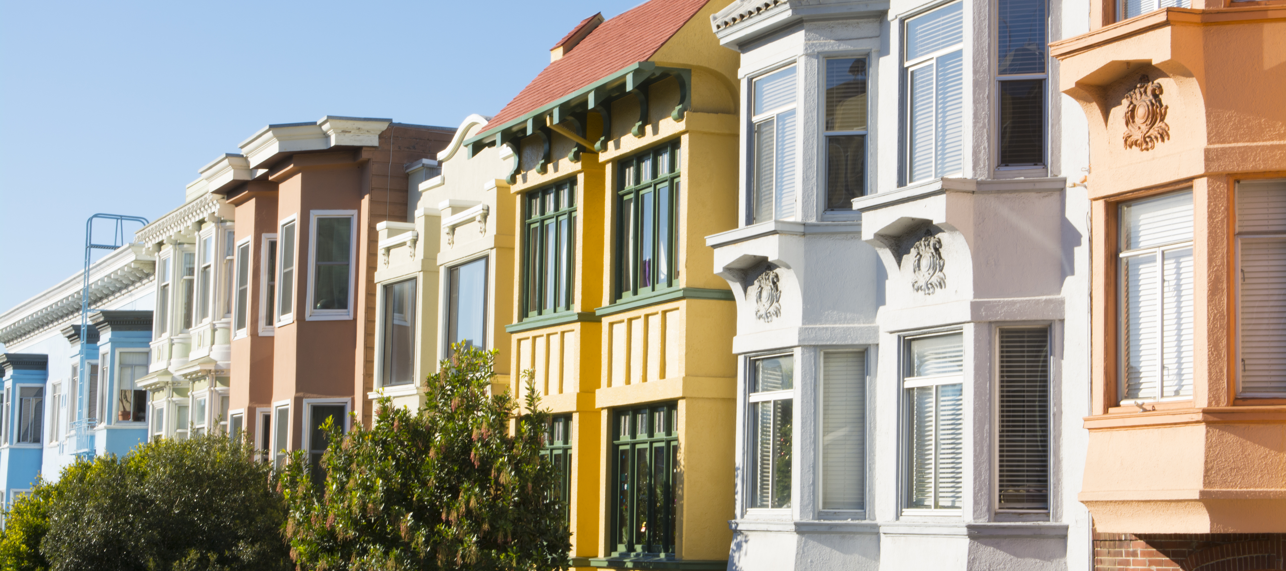San Francisco California Russian Hill colorful Victorian houses on Hyde and Broadway Streets in sunshine with abstract windows.