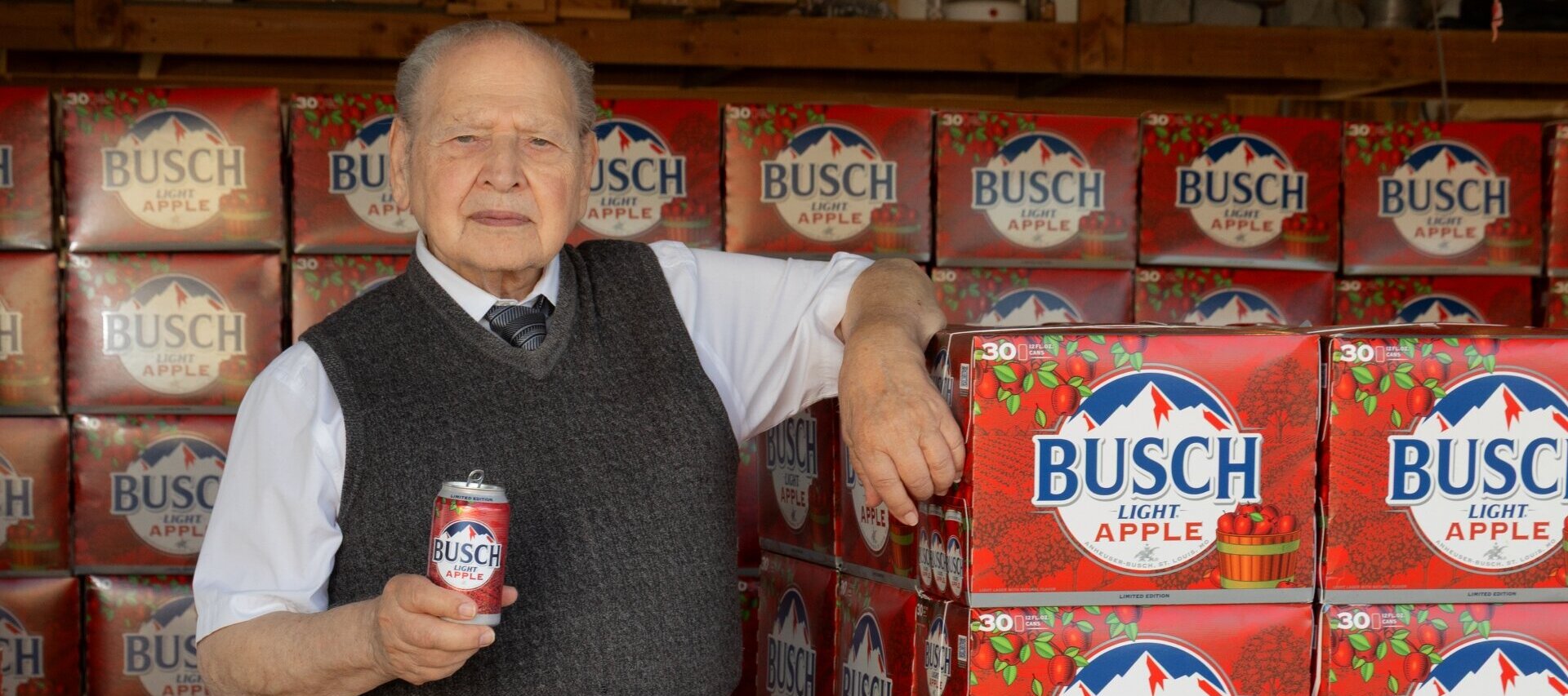 A photo of Apple co-founder Ronald Wayne with limited edition apple lager from Anheuser-Busch