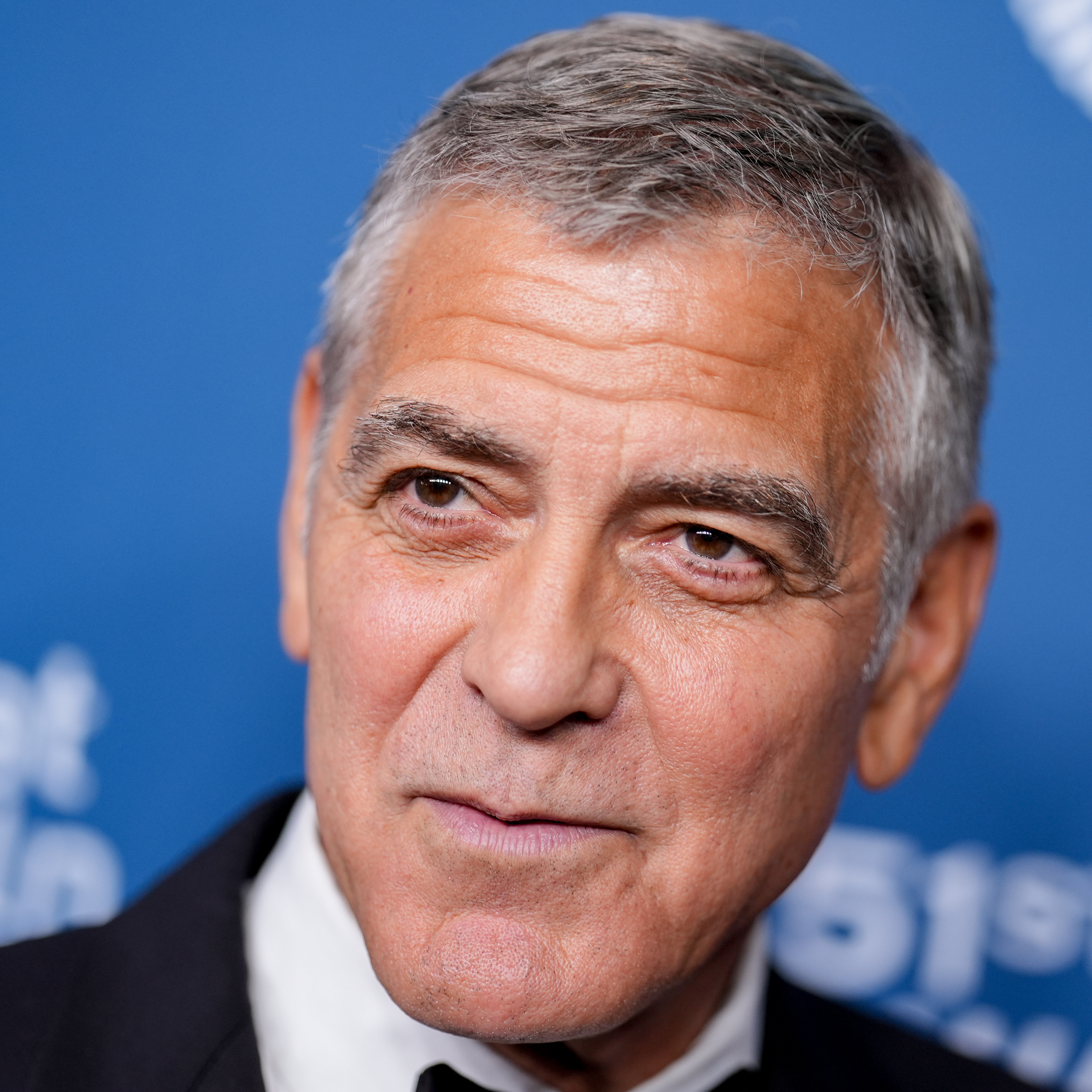 A close-up photo of George Clooney wearing a nice tuxedo