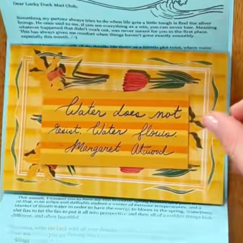 A side-by-side of Kiki Klassen, the founder of the Lucky Duck Mail Club, alongside an example of one of the letters in from her snail mail subscription service.