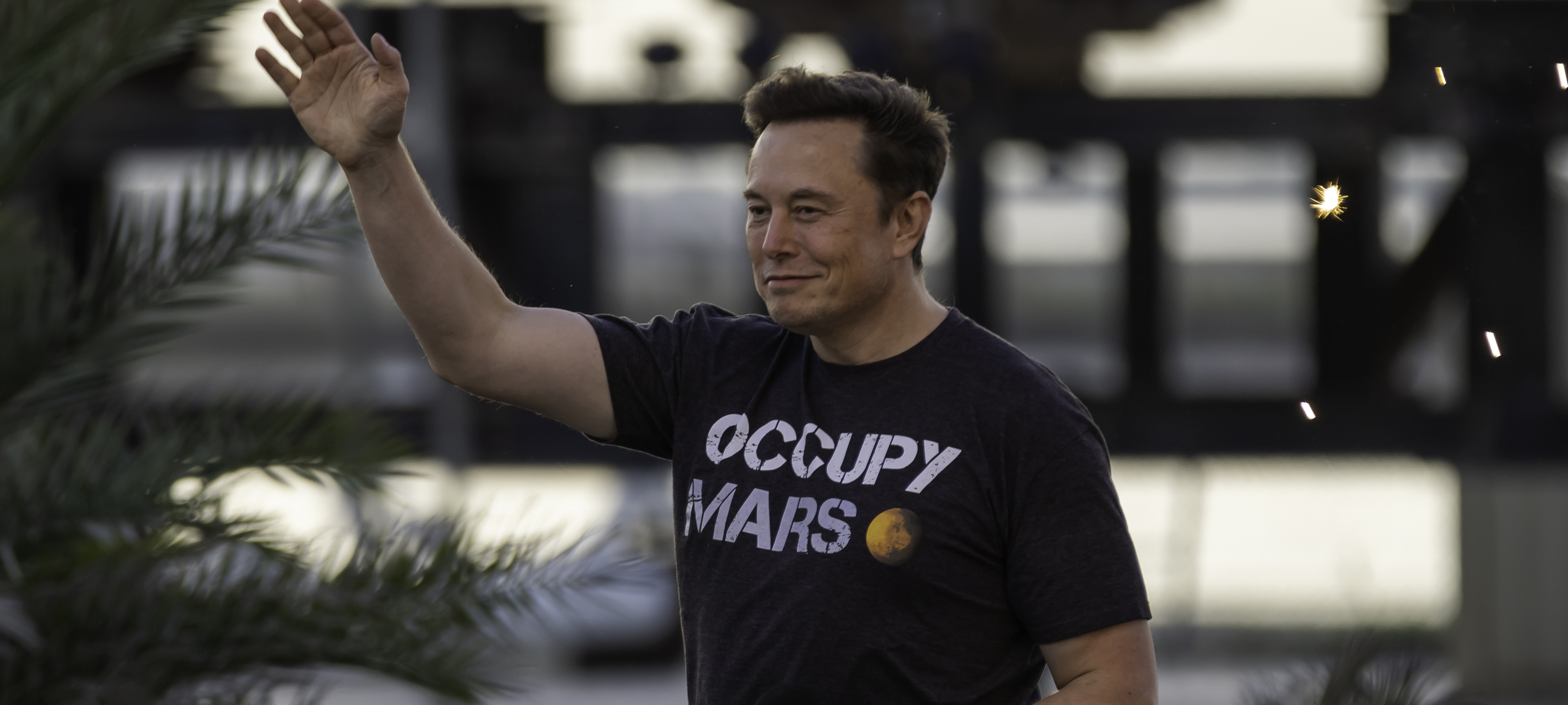 Elon Musk wears an “Occupy Mars” t-shirt.