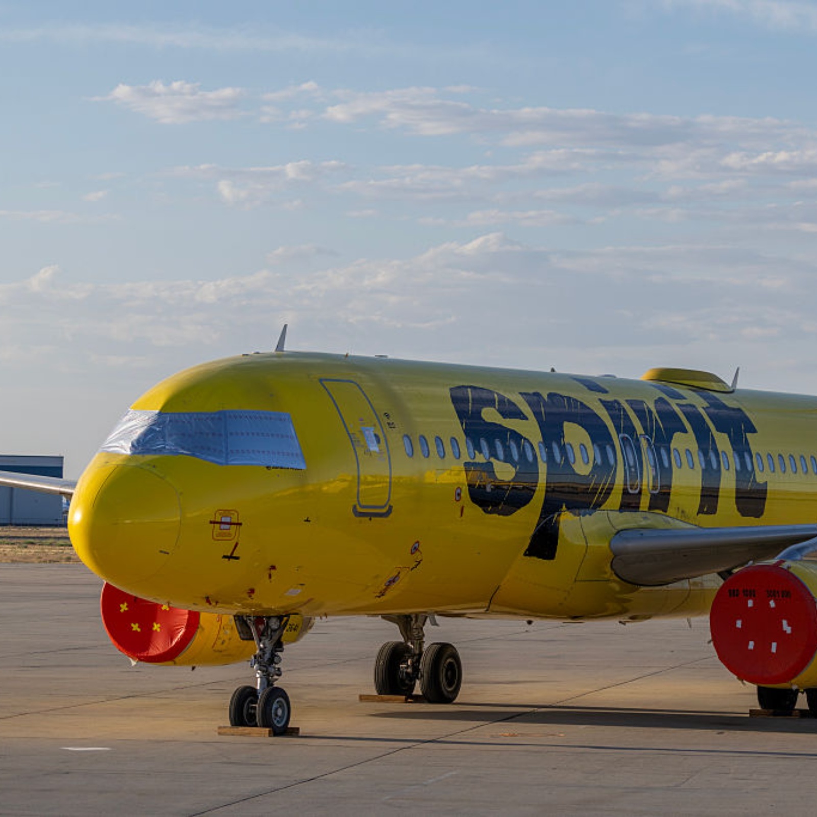 A split image of TikToker Hunter Peterson (left) and a Spirit Airlines plane (right)