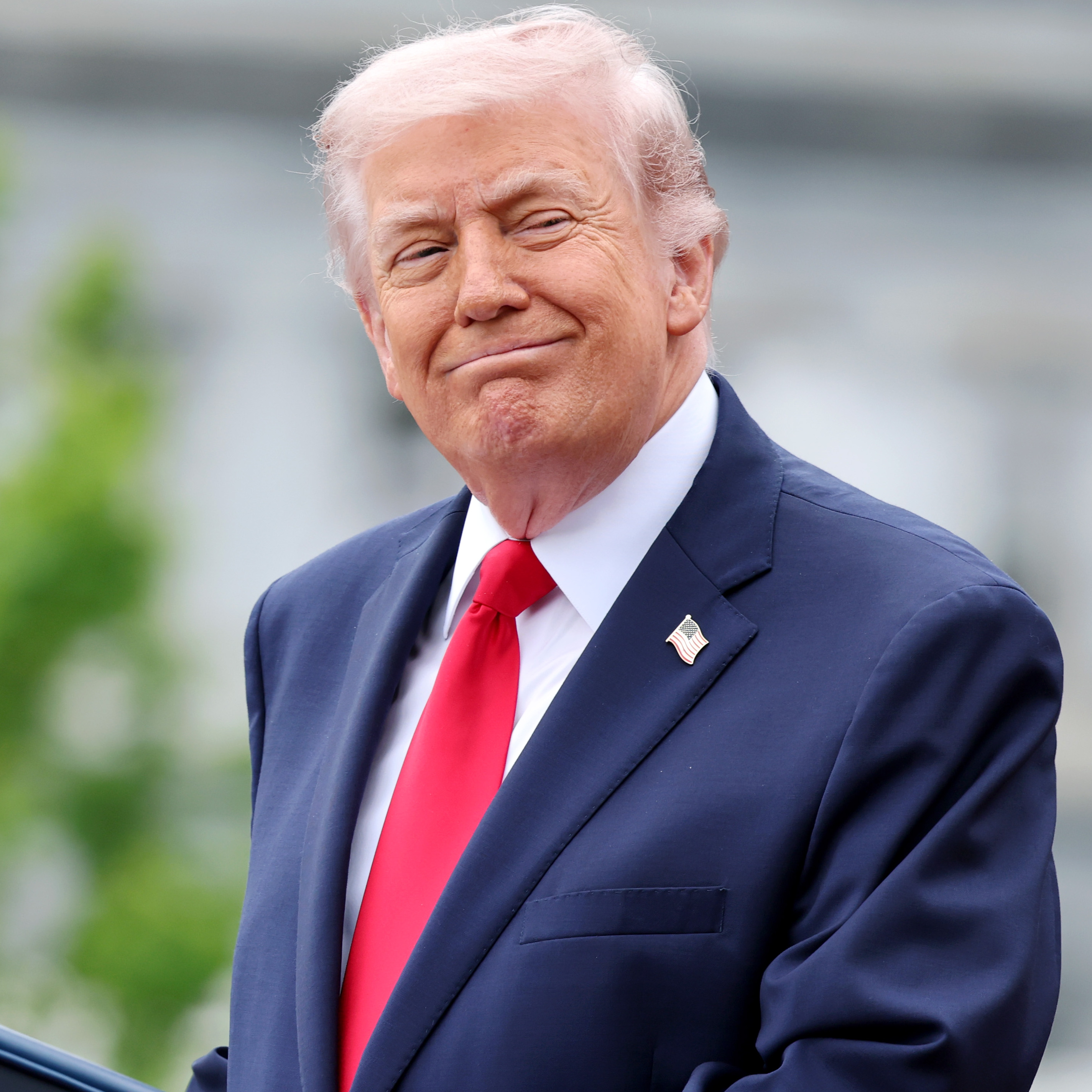 President Trump stands at the podium at a White House event in 2026.