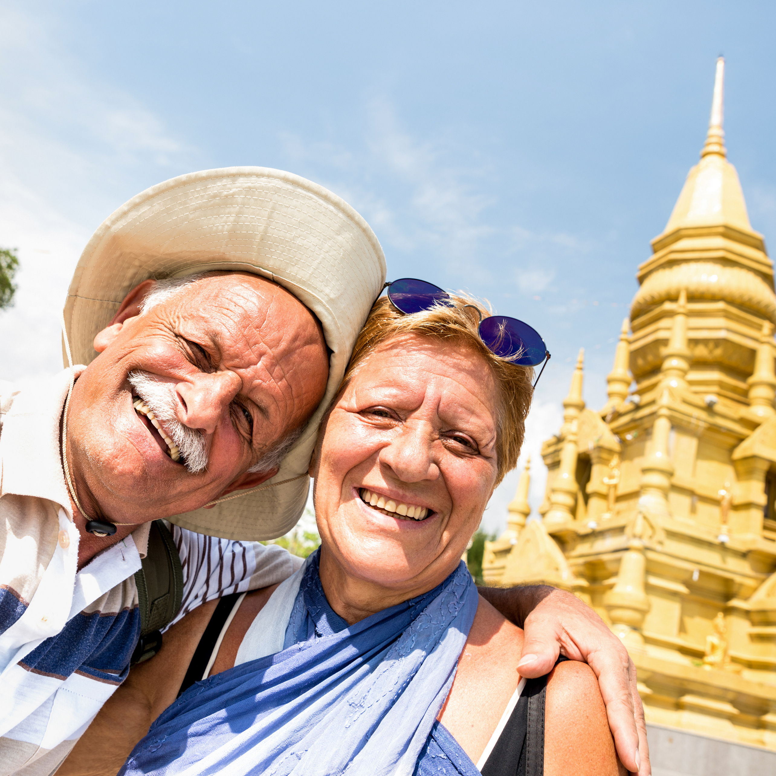 Senior couple taking a selfie at a temple in Ko Samui in Thailand.