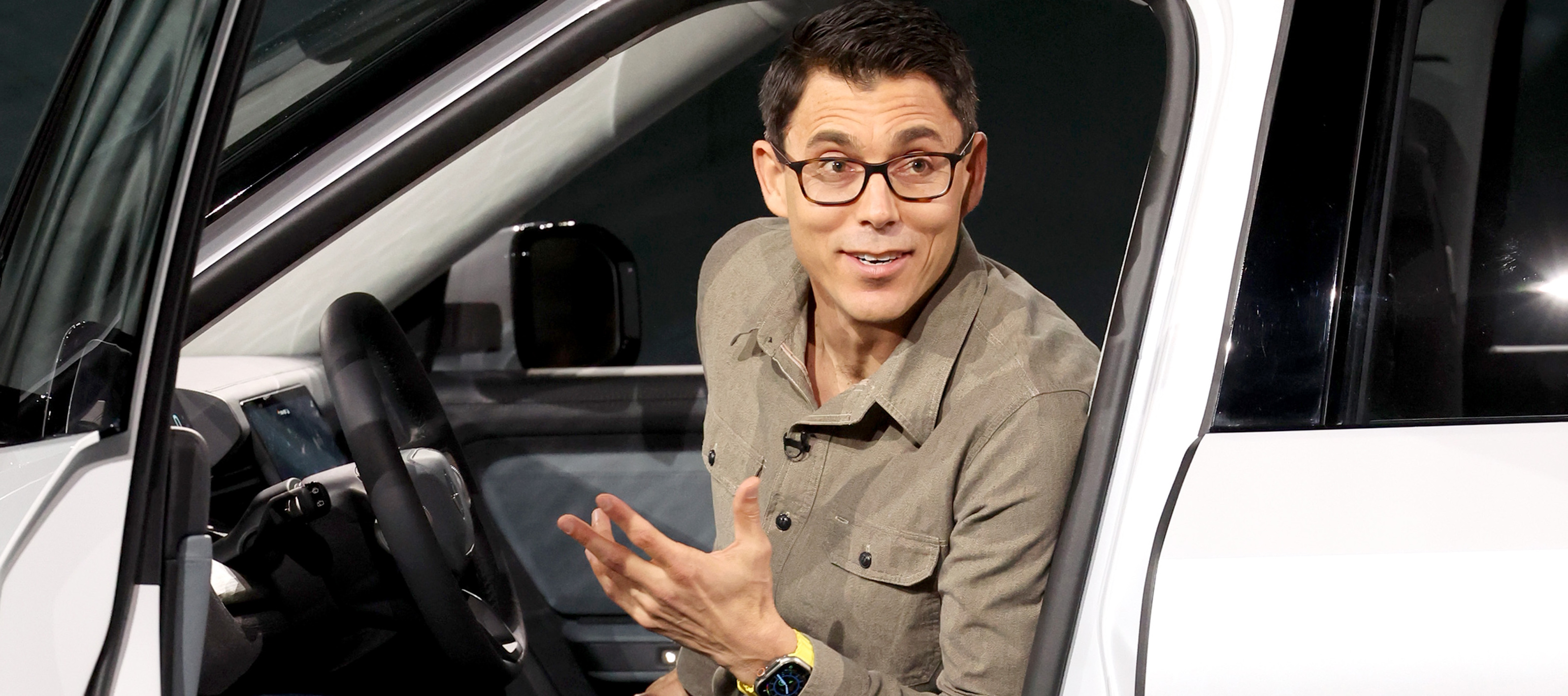 Rivian CEO RJ Scaringe sits inside the Rivian R2 electric vehicle.