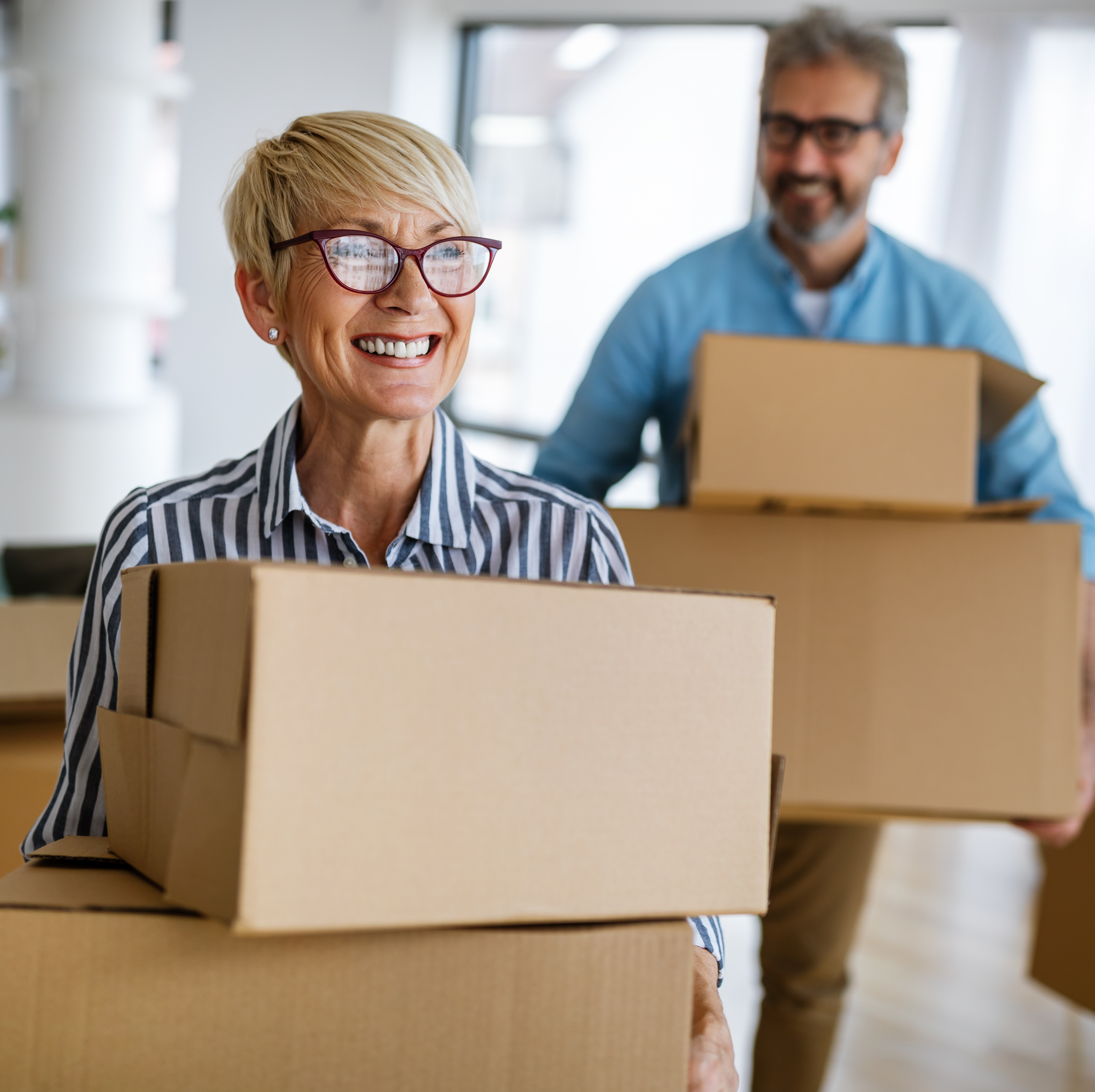 An older couple moving into a new home.