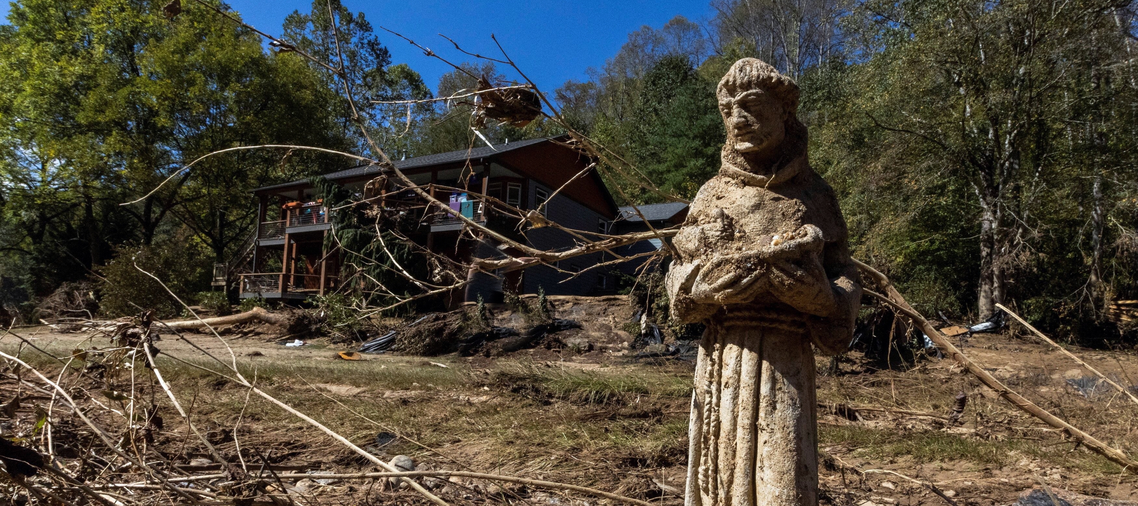 North Carolina reels from Hurricane Helenes aftermath, with flooded streets, destroyed homes, and emergency crews aiding recovery efforts.