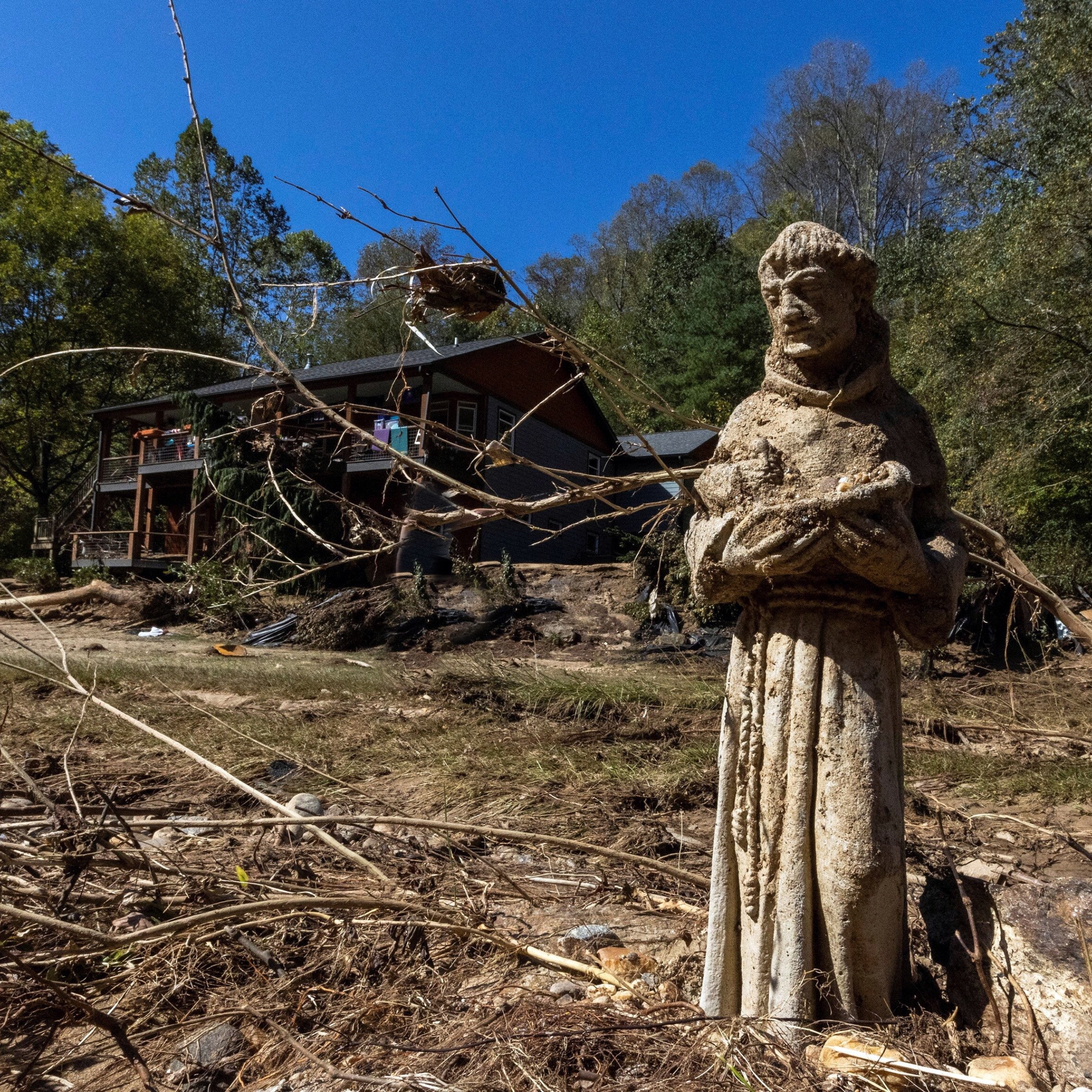 North Carolina reels from Hurricane Helenes aftermath, with flooded streets, destroyed homes, and emergency crews aiding recovery efforts.