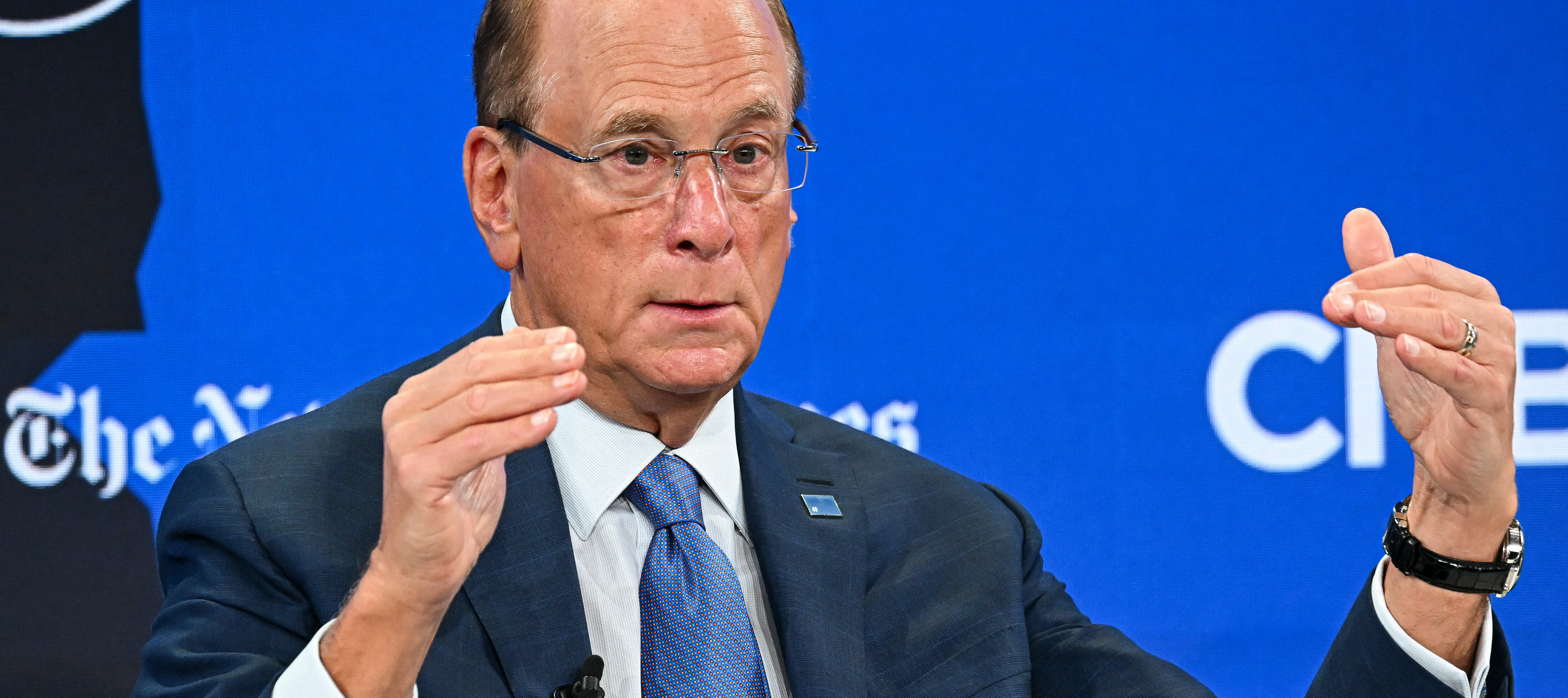 Larry Fink gestures as he speaks during the World Economic Forum in 2026.