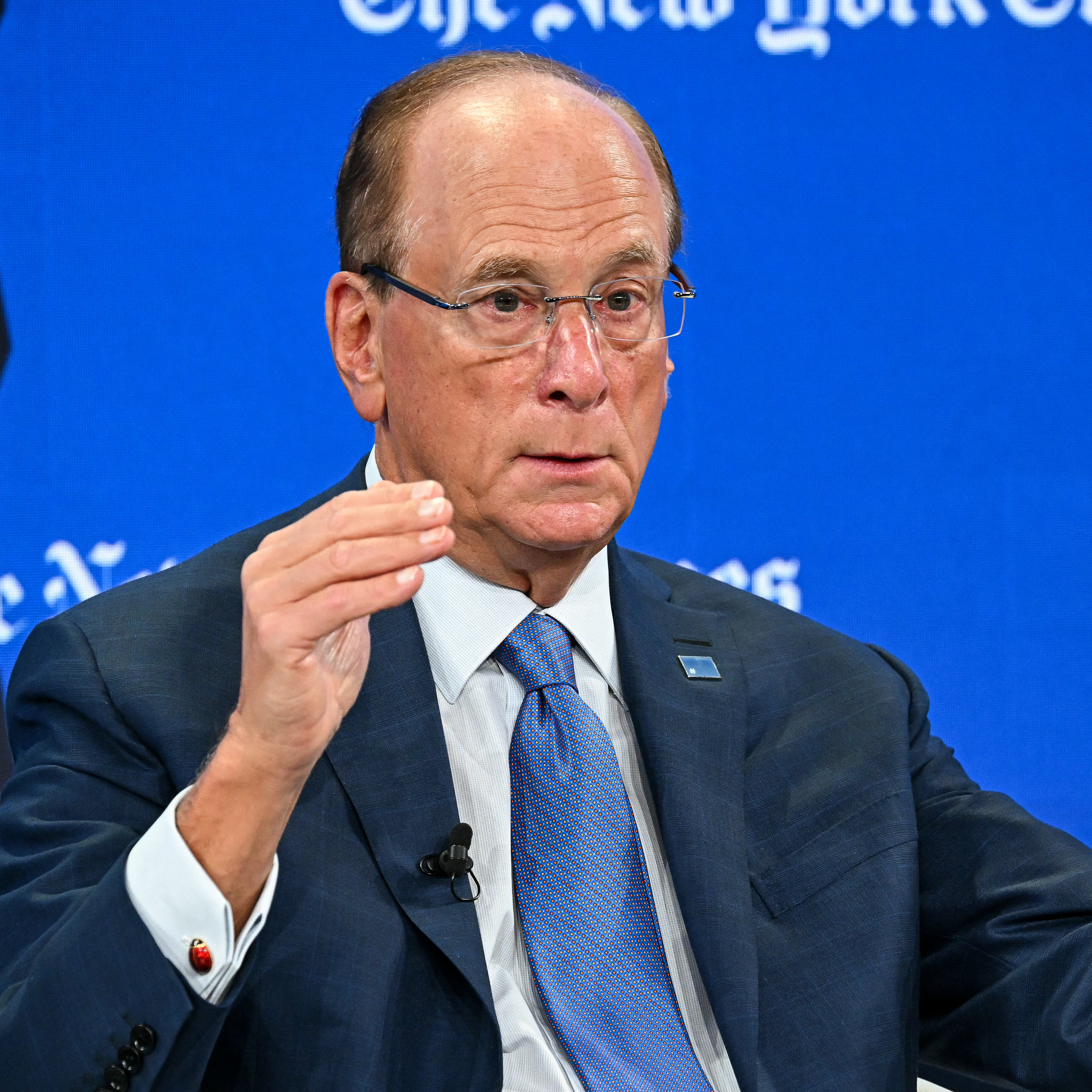 Larry Fink gestures as he speaks during the World Economic Forum in 2026.