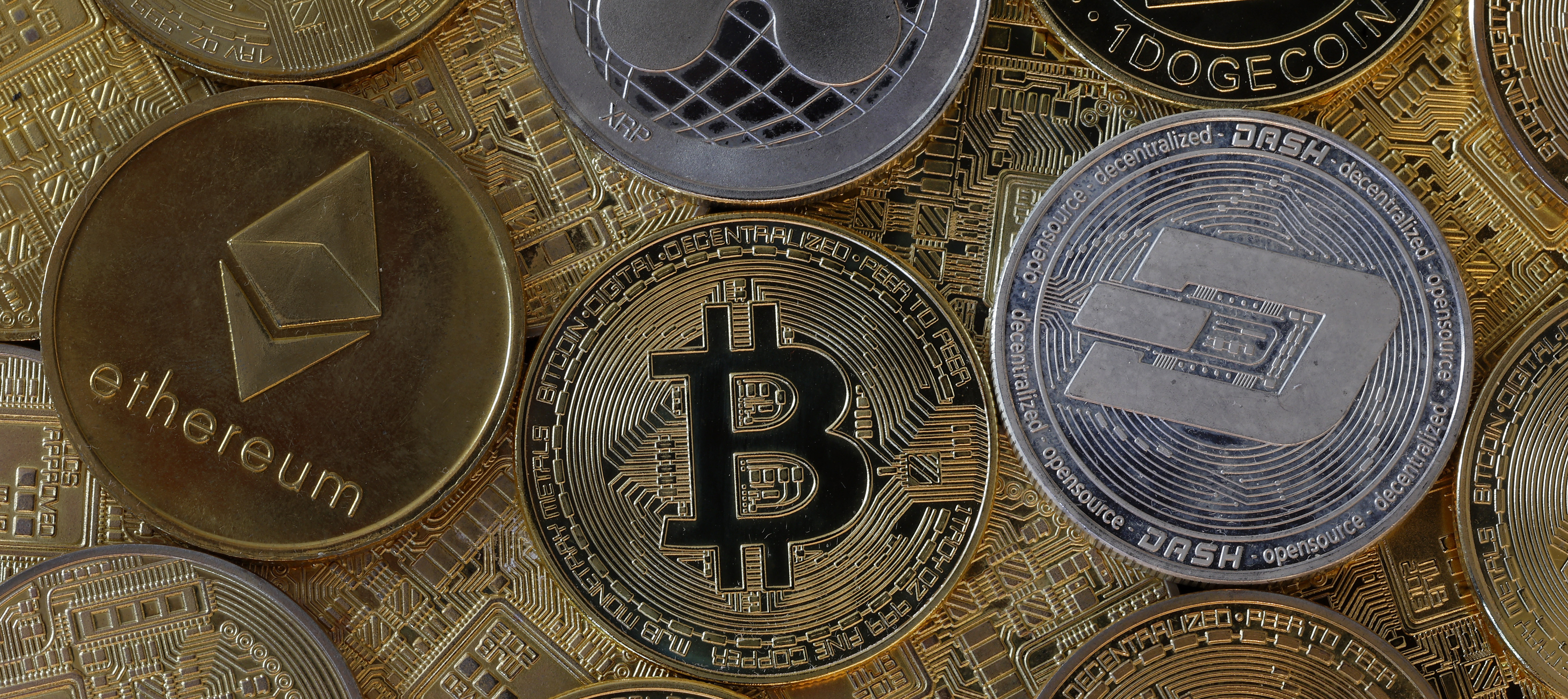 Novelty coins on display, including Ethereum, Bitcoin, and Dogecoin.