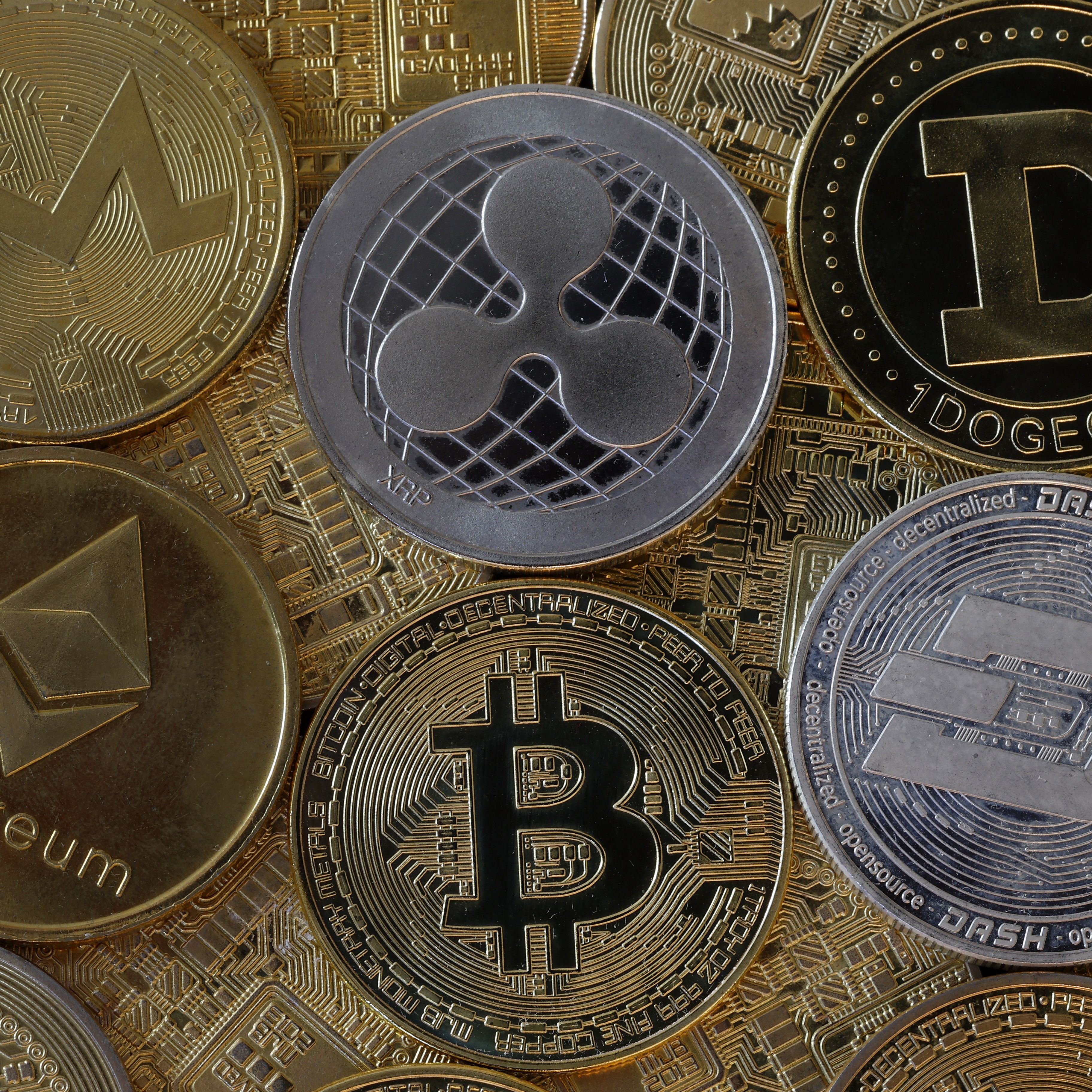 Novelty coins on display, including Ethereum, Bitcoin, and Dogecoin.