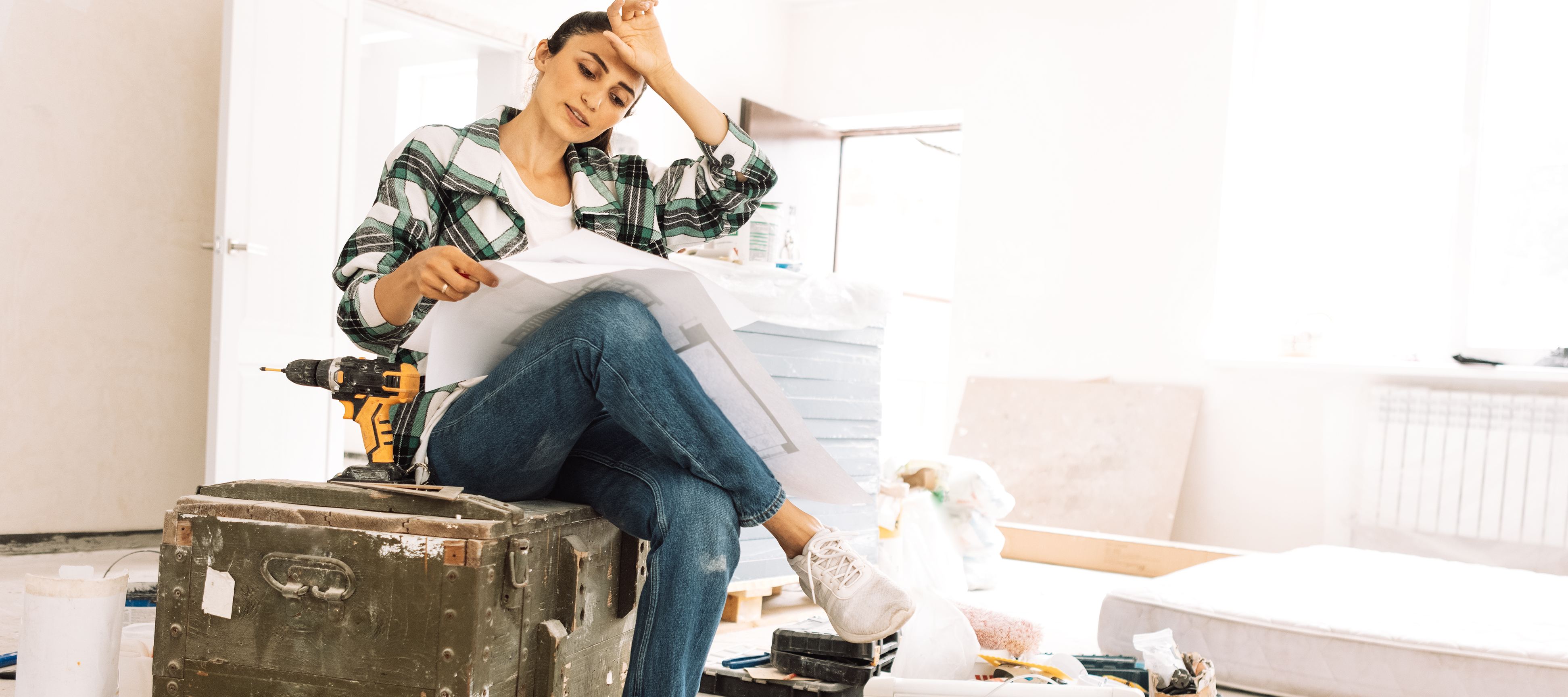 Young woman tired from house repairs