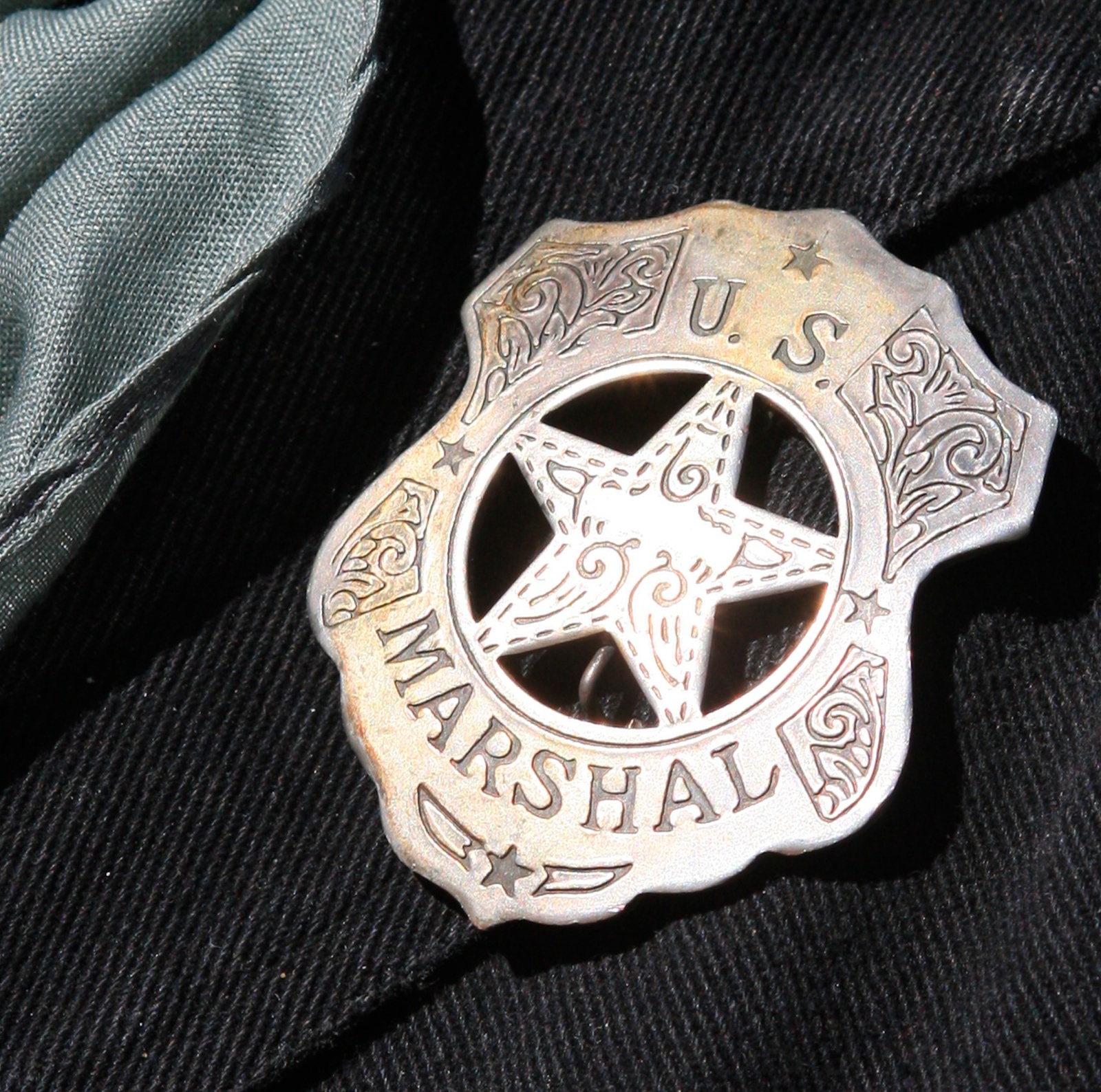 A close-up shot of a US marshal badget