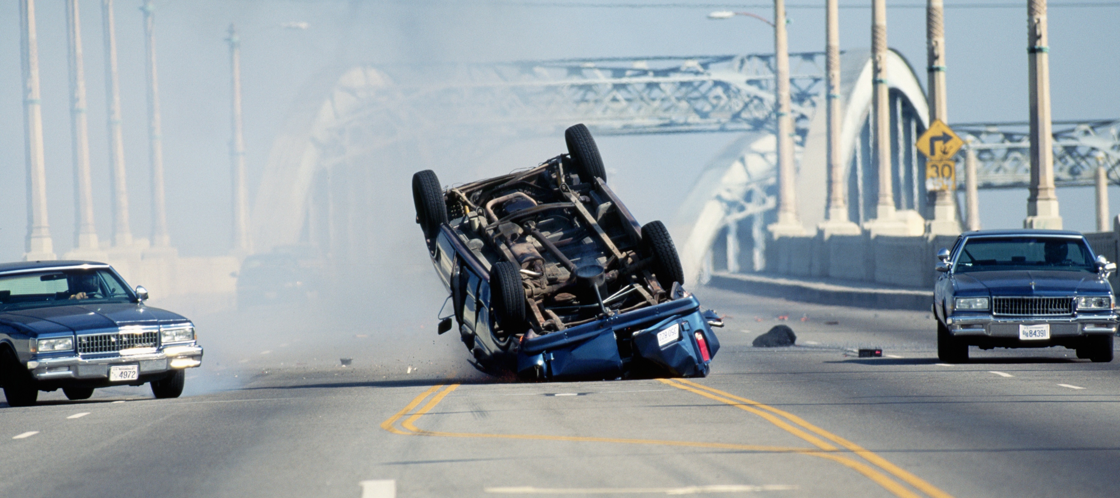 A car crashes as a stunt during the filming of a movie