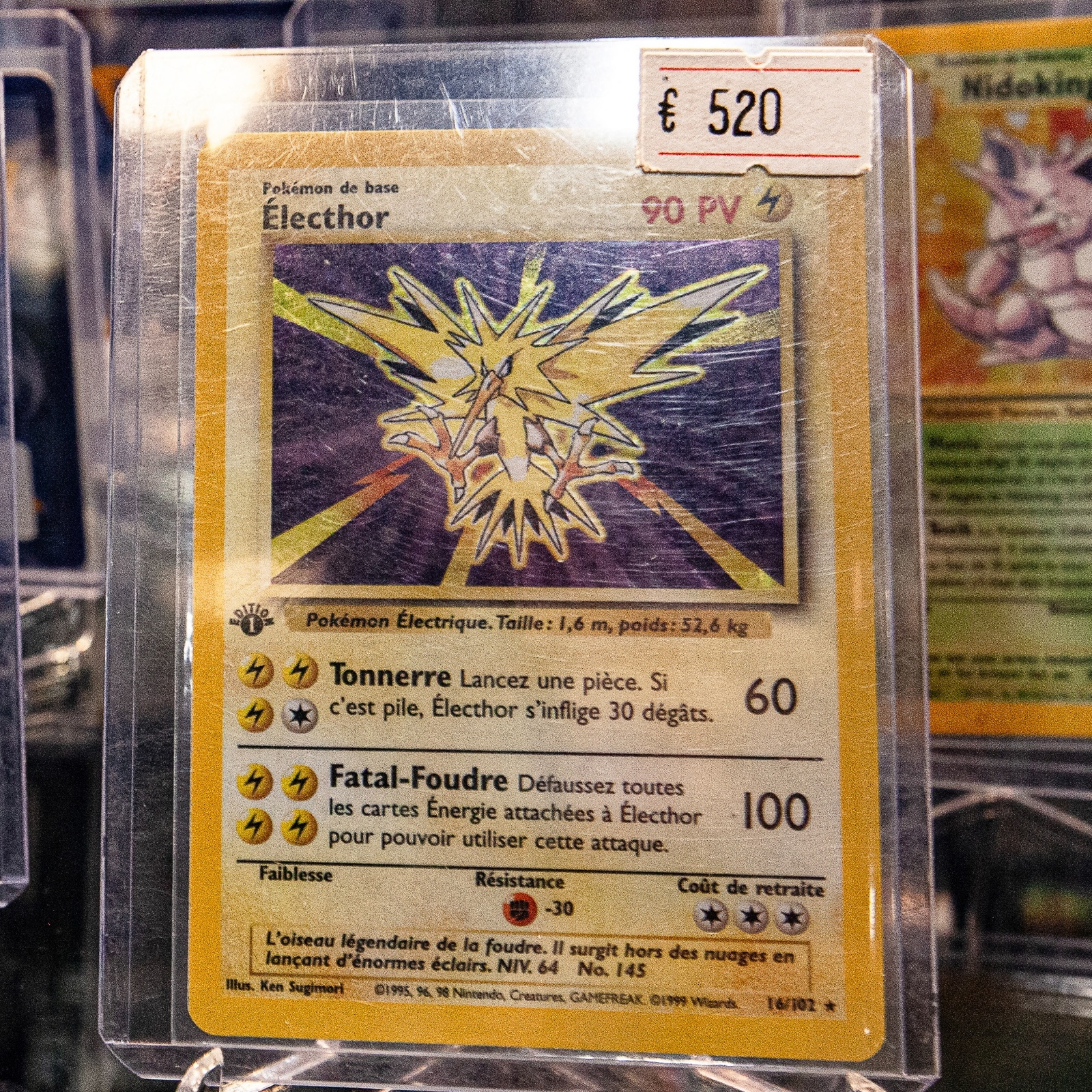 Pokemon cards on display with their sale value next to them